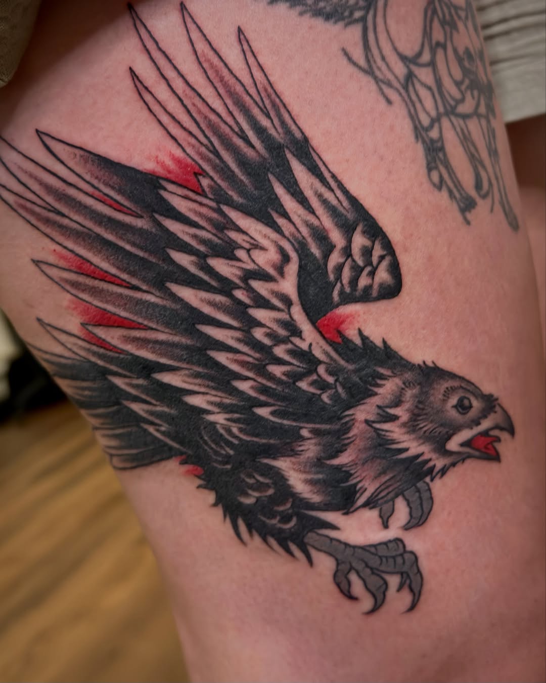 Eagle American traditional tattoo on the thigh by Craig Ryans