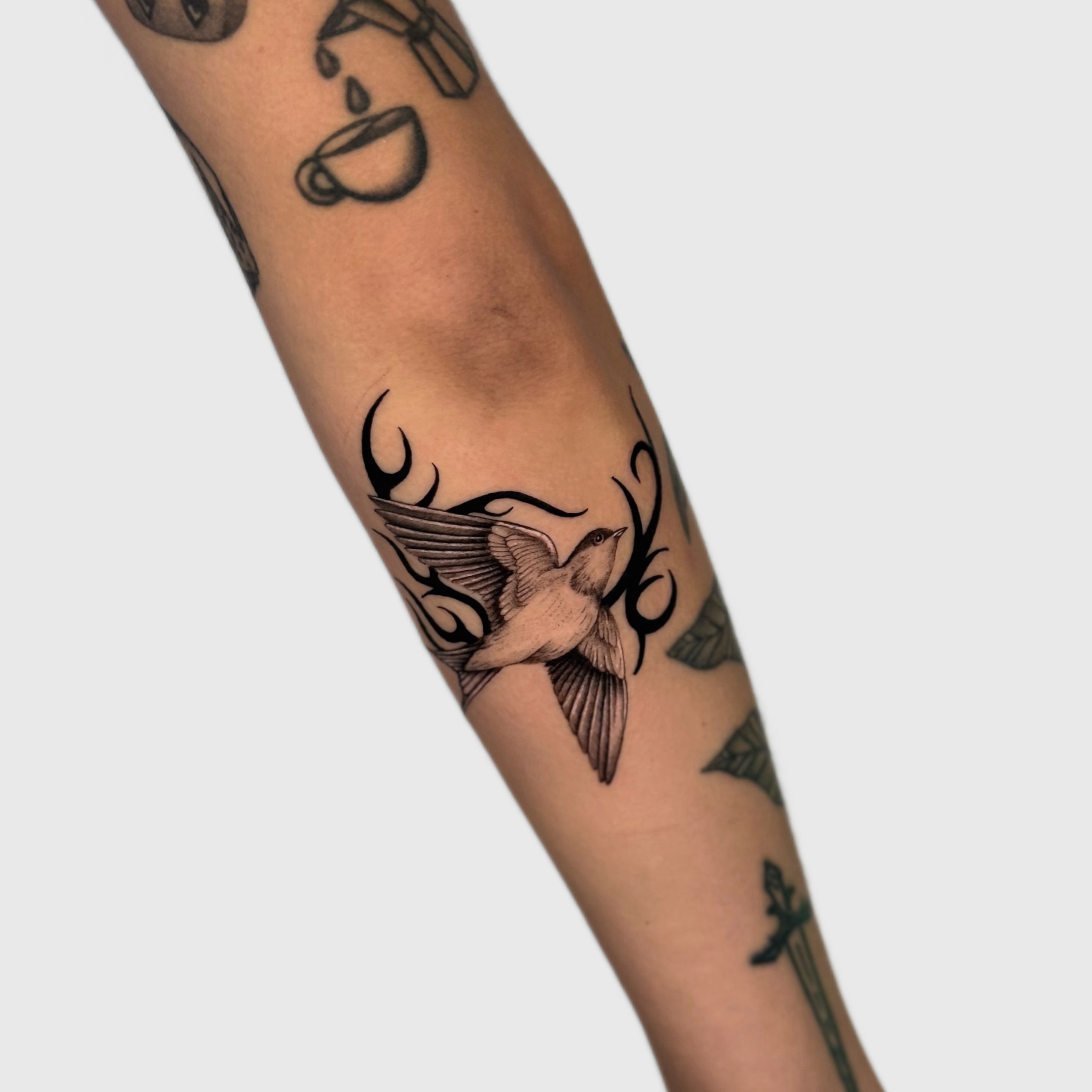 Bird tribal tattoo on the forearm by Miami Tattoo Artist, Miami, Florida