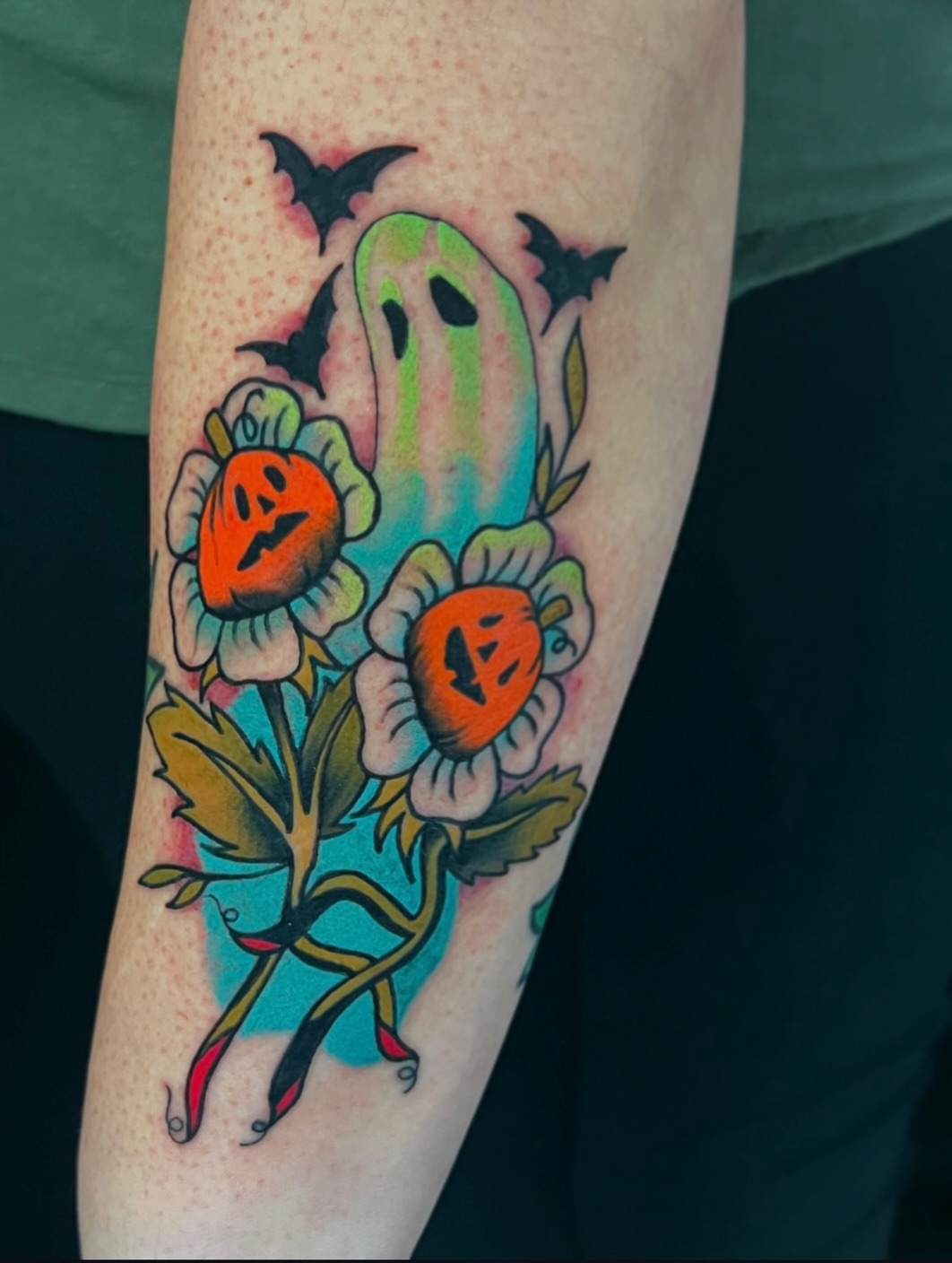 Pumpkin ghost flowers American traditional tattoo on the forearm by Andrea Patterson