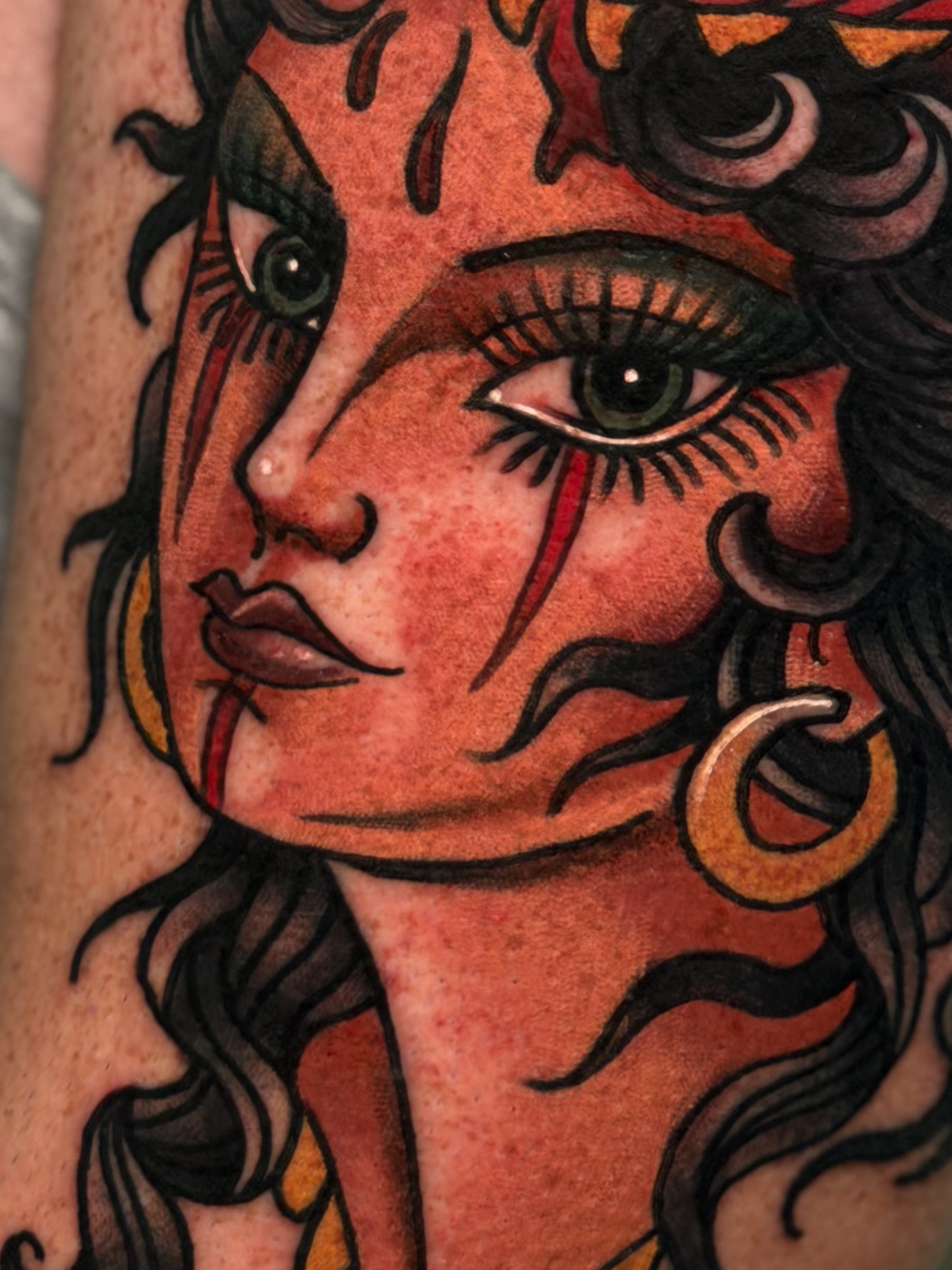 Woman's face American traditional tattoo on the forearm by Cory Cartwright