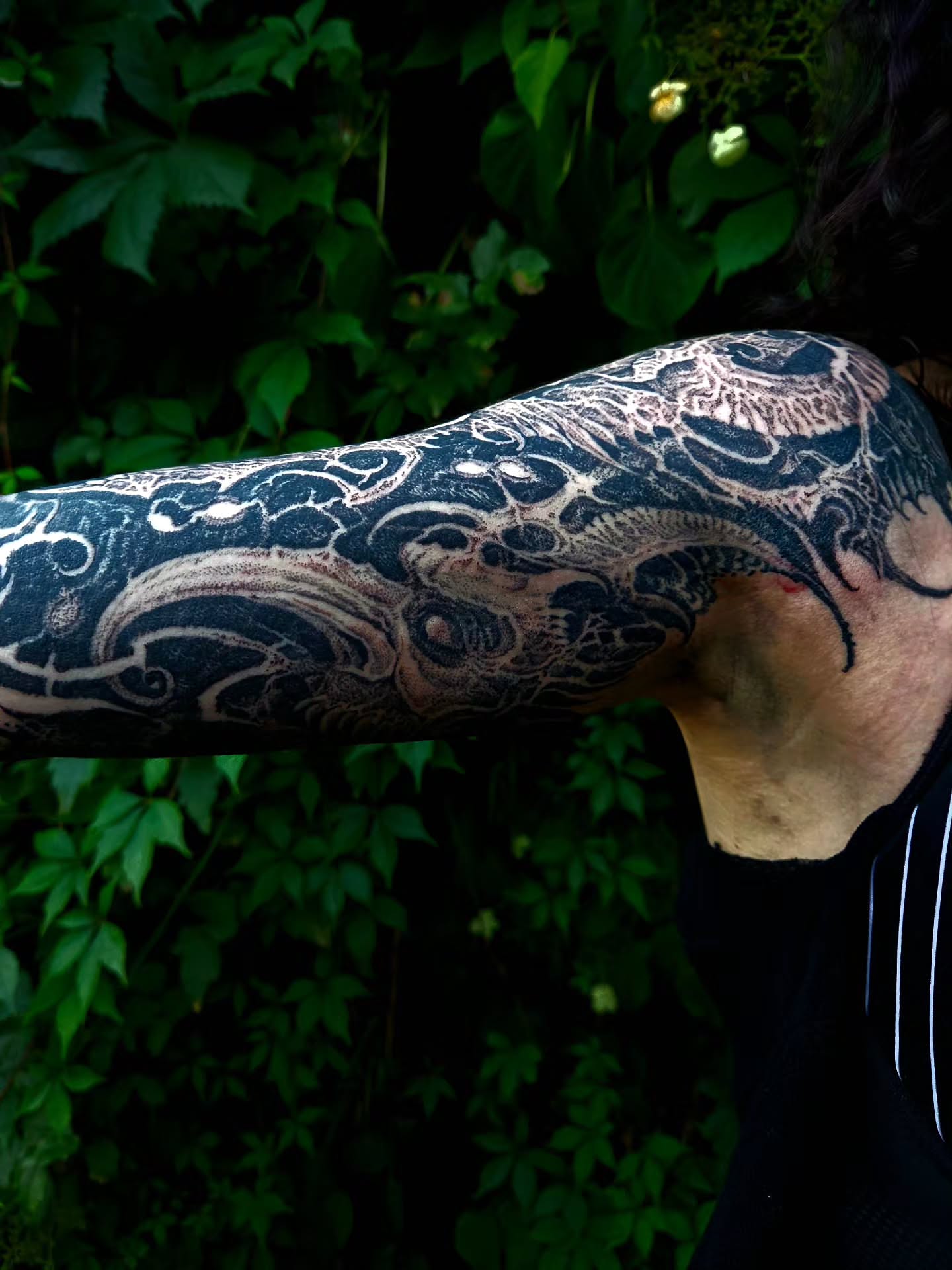 Abstract design black and grey tattoo on the upper arm by @hellscribe