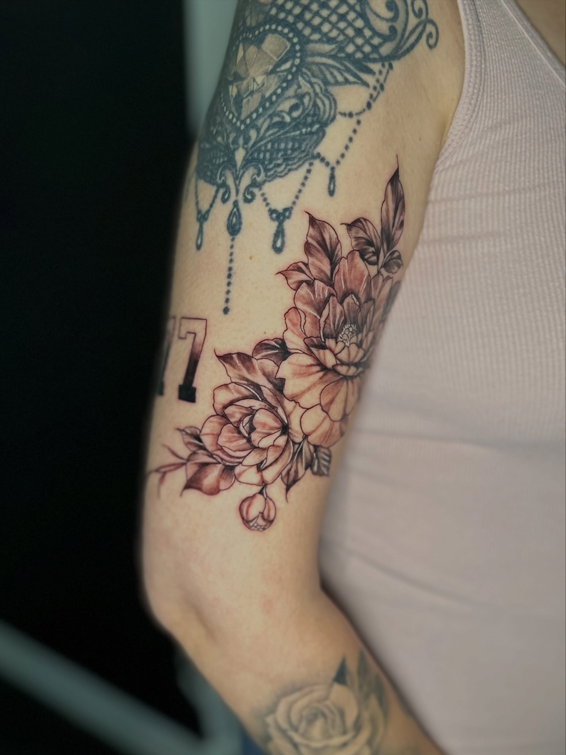 Floral bouquet dotwork tattoo on the forearm by AJ