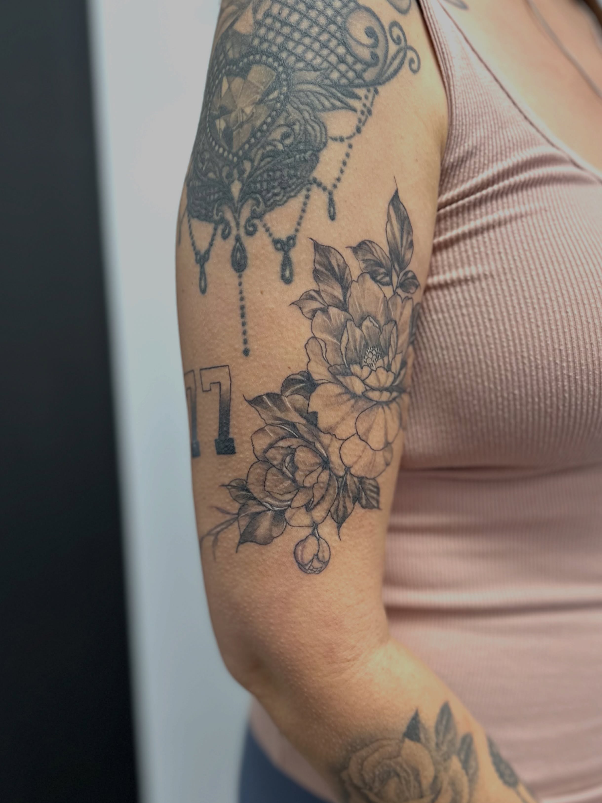 Floral bouquet ornamental tattoo on the forearm by AJ