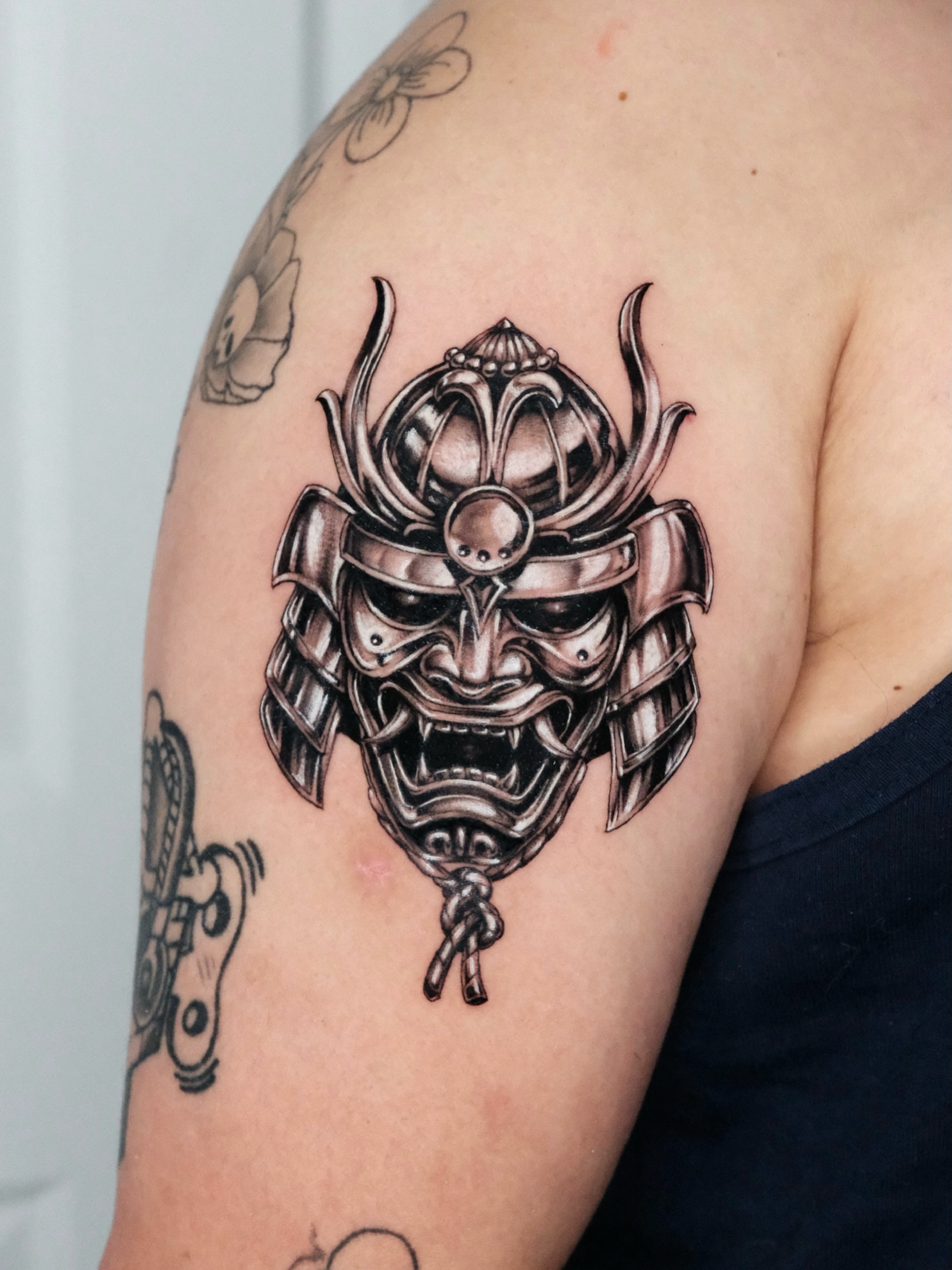 Samurai helmet realism tattoo on the shoulder by Bay Area Tattoo Artist