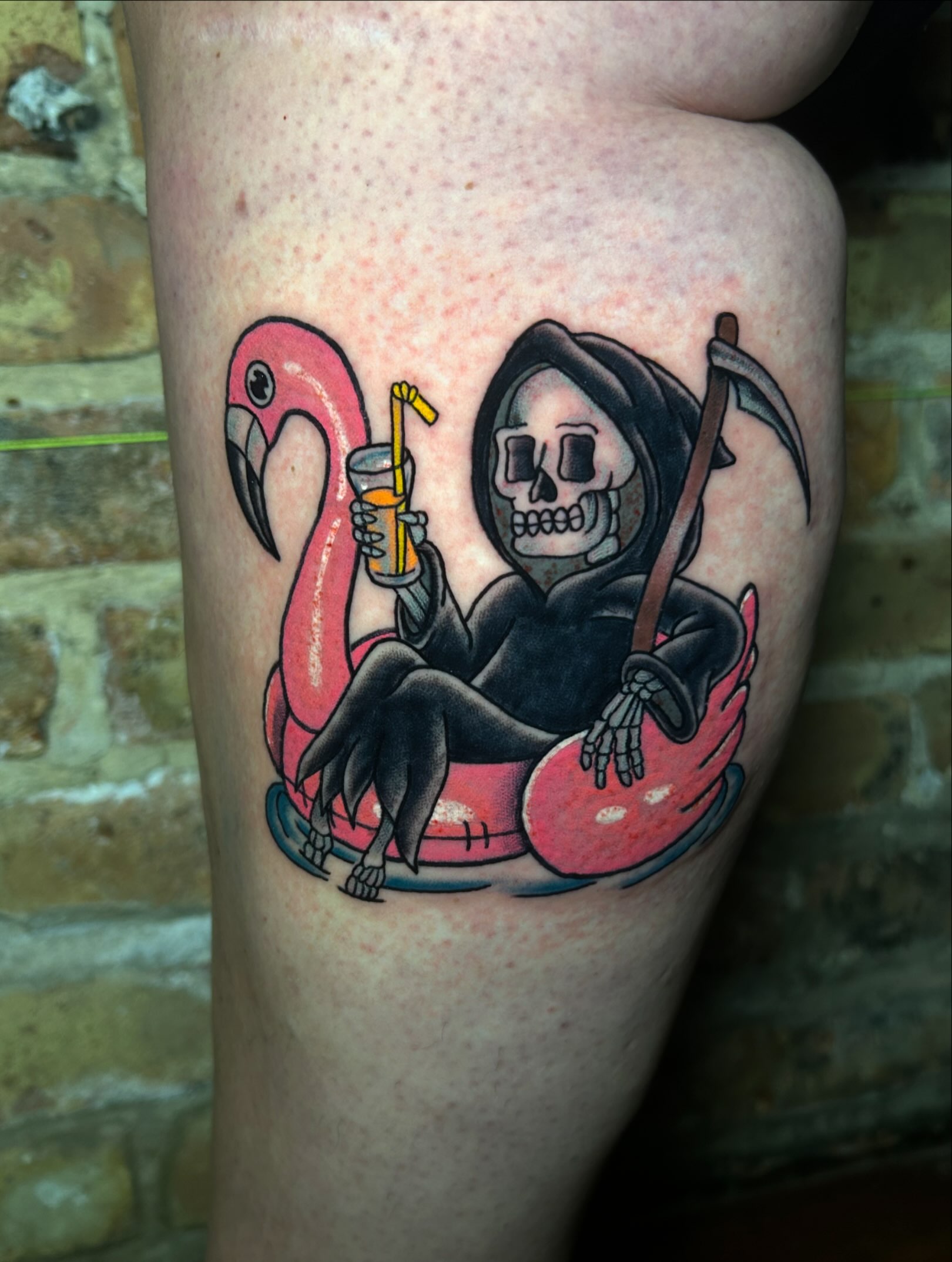 Reaper on flamingo American traditional tattoo on the thigh by Alycia