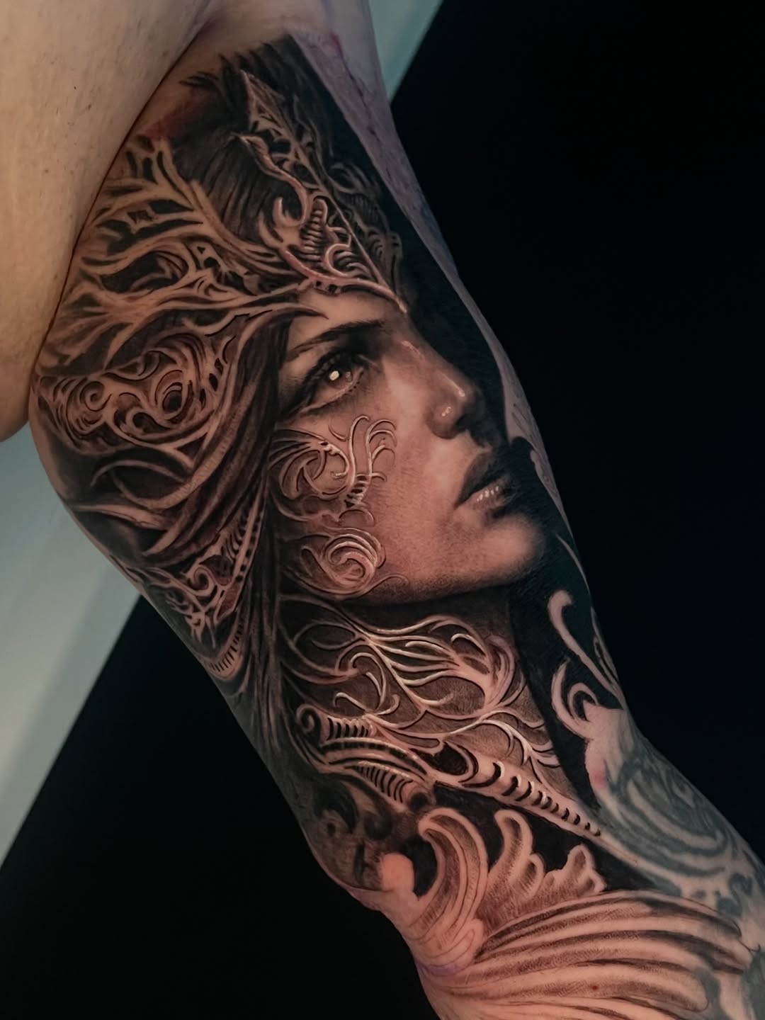 Woman with ornate headdress realism tattoo on the forearm by Tattoo Artist