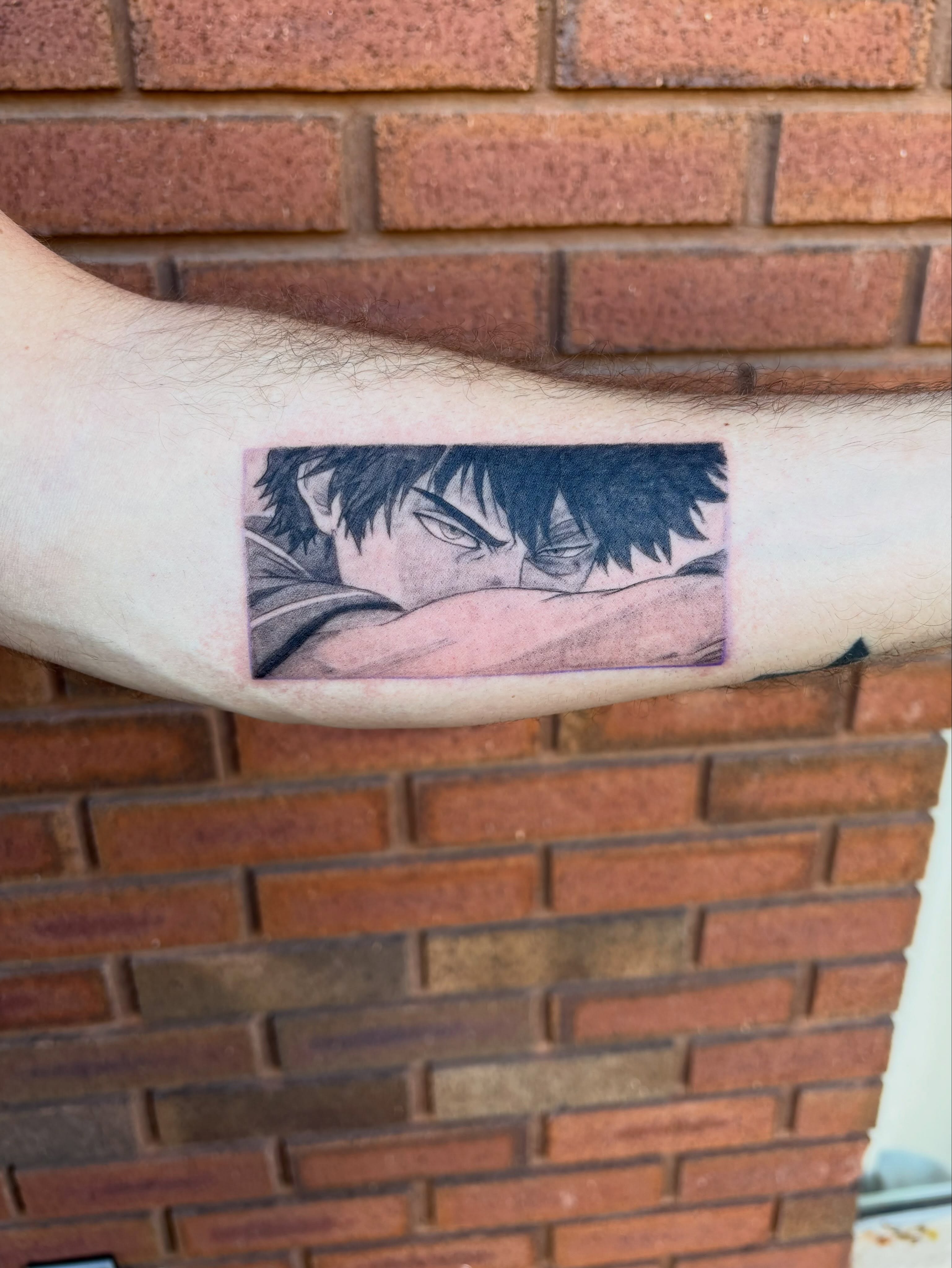 Anime character anime tattoo on the forearm by Sierra Maynard