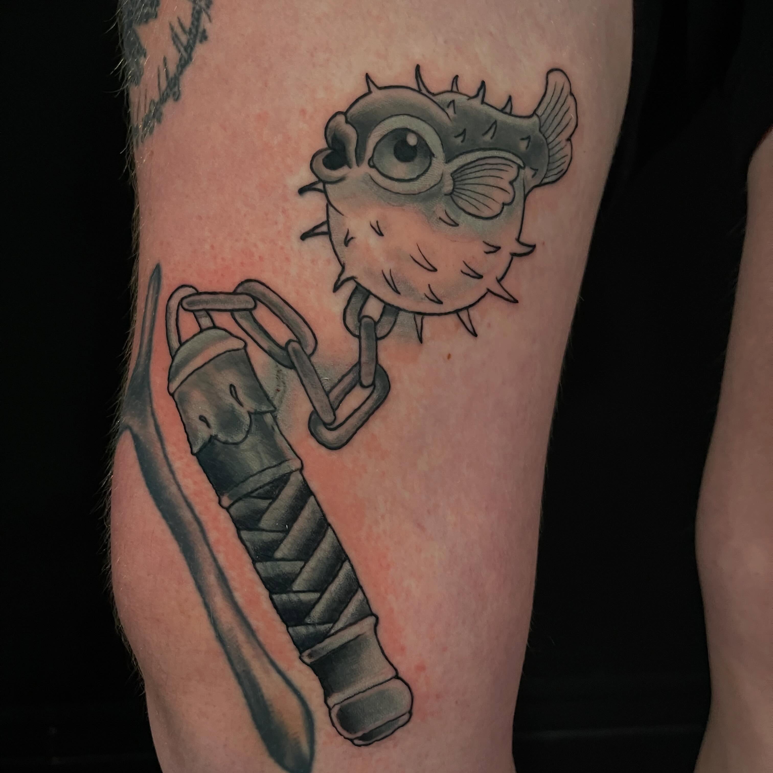 Puffer fish and katana black and grey tattoo on the forearm by ✨𝕄𝕚𝕜𝕖 𝕆’𝔽𝕒𝕣𝕣𝕖𝕝𝕝✨, Denver, Colorado