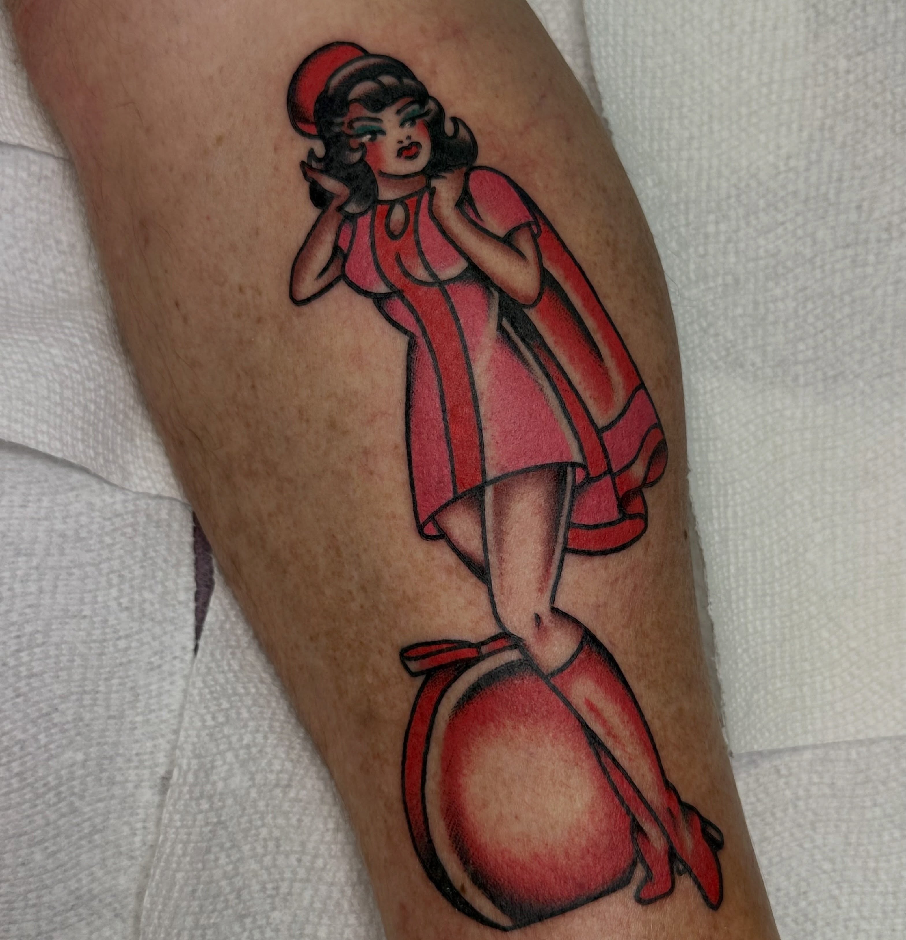 Pin-up girl American traditional tattoo on the forearm by Amanda Bonhomme, Las Vegas, Nevada