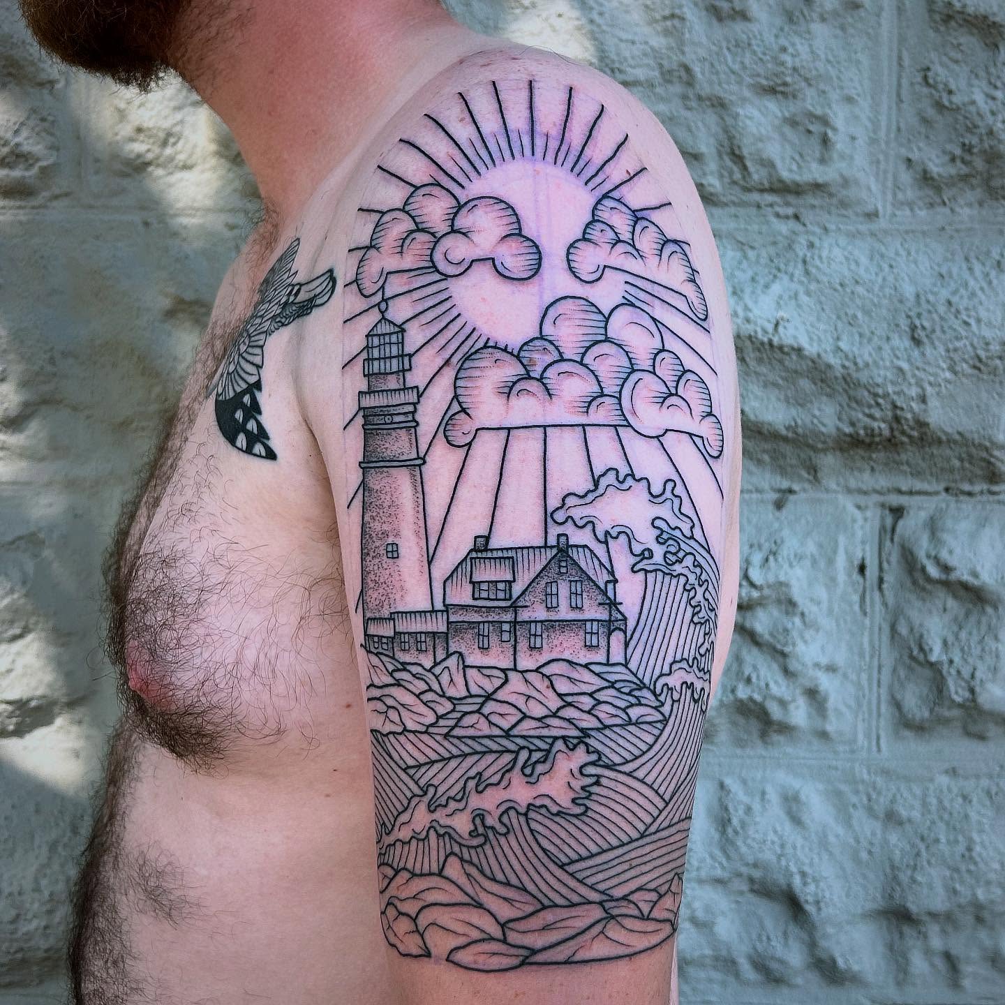 Lighthouse and house dotwork tattoo on the forearm by Erica Finley