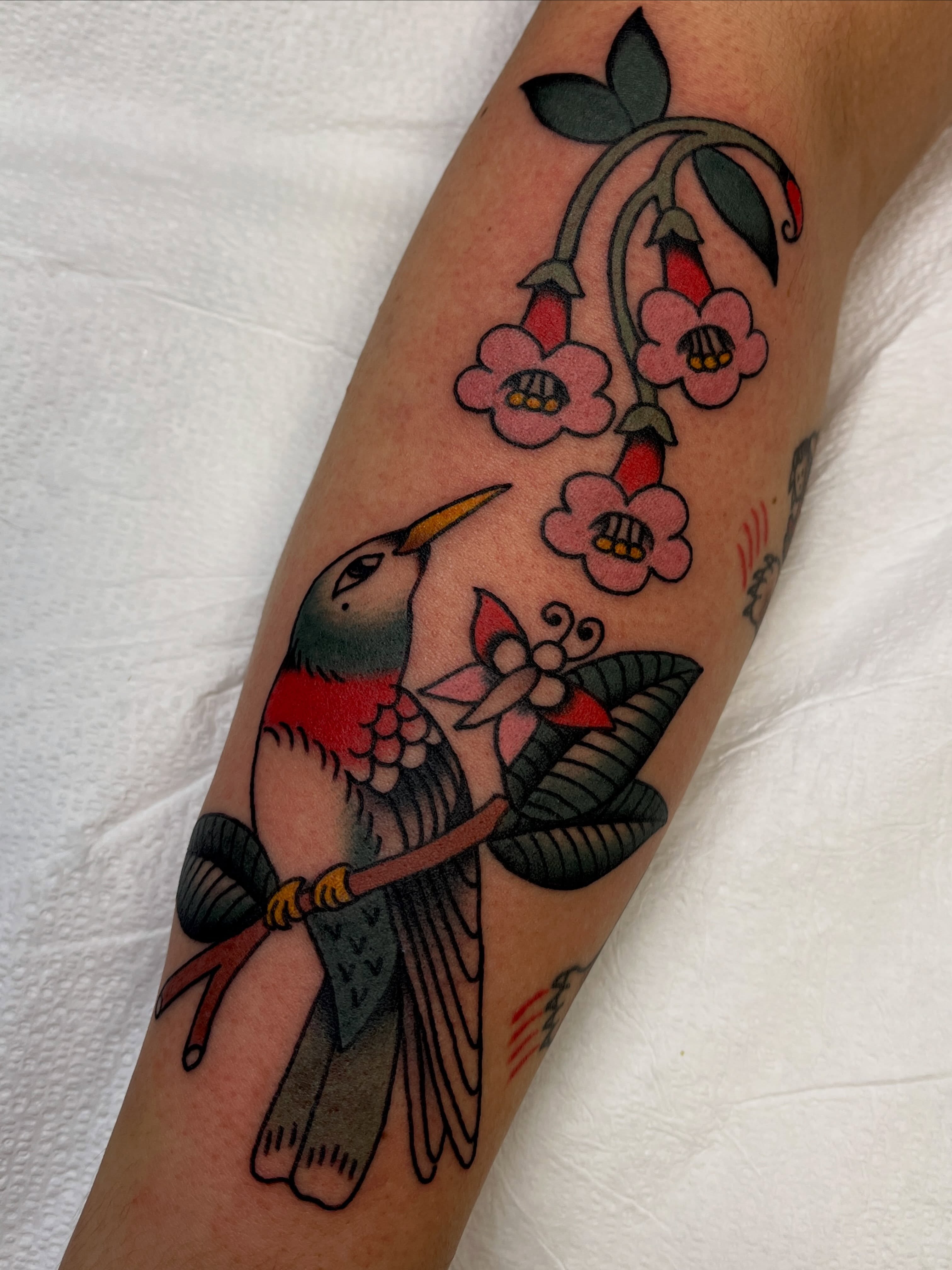 Hummingbird and flowers American traditional tattoo on the forearm by 🌞all Bodies Welcome🌞