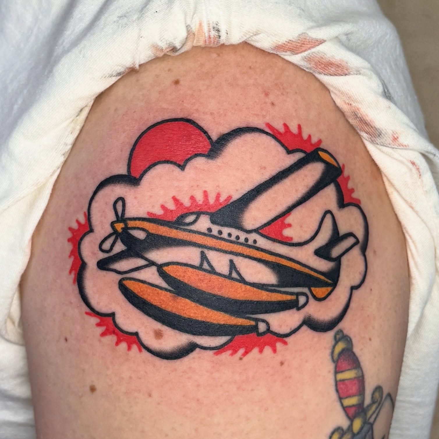 Airplane American traditional tattoo on the shoulder by Sam