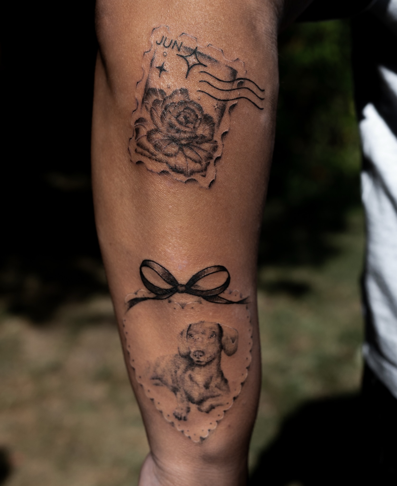 Rose and dog realism tattoo on the forearm by Boise Tattoo Artist