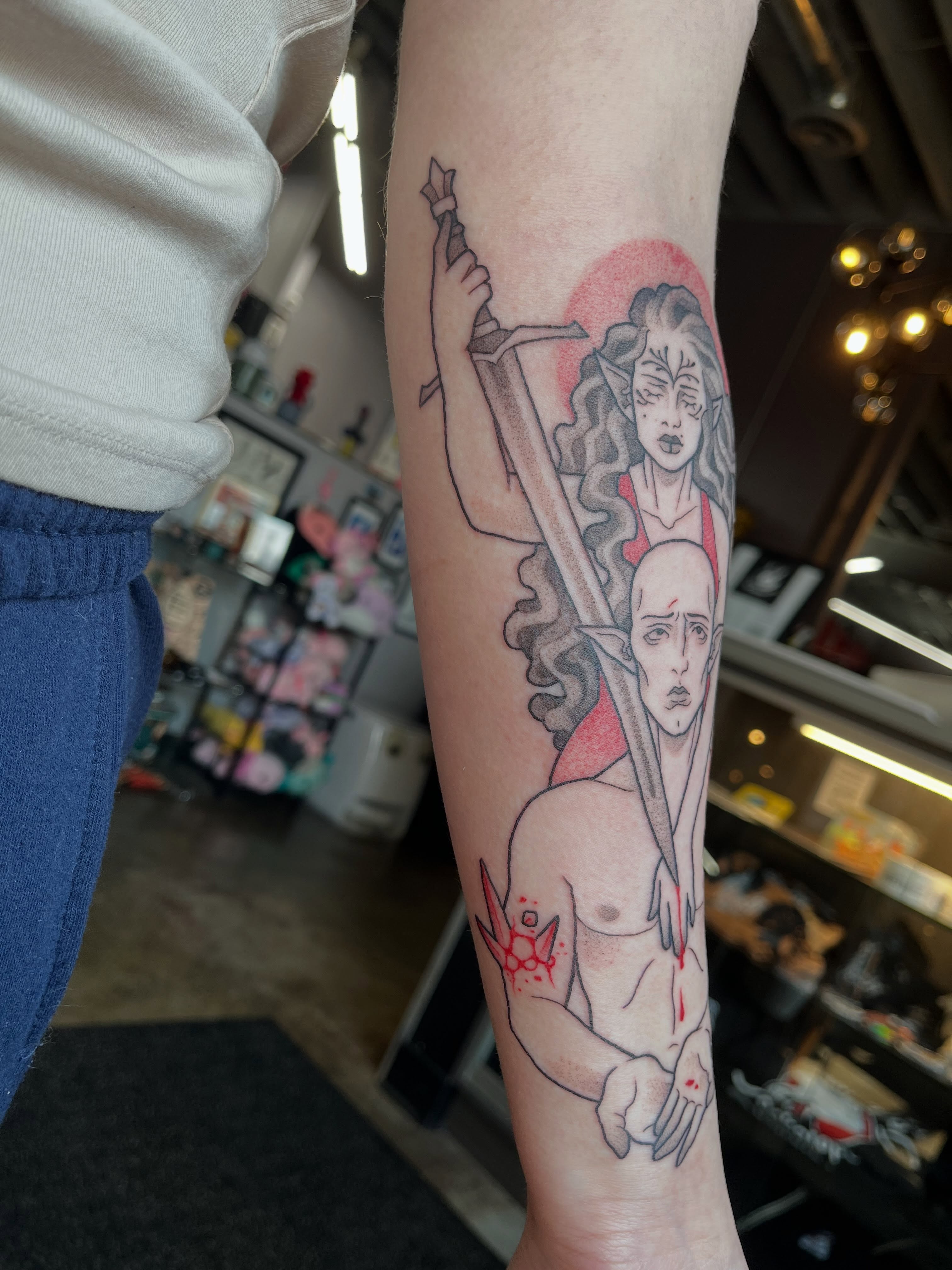 Sword-wielding woman and man anime tattoo on the forearm by bunny, Minneapolis, Minnesota