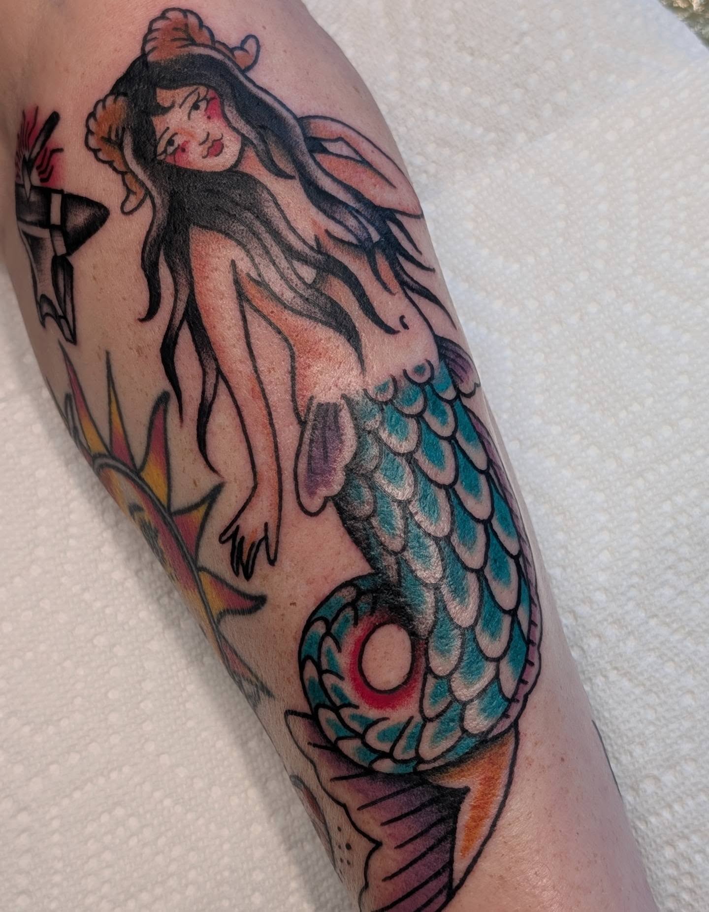 Mermaid American traditional tattoo on the forearm by Alexandria Green