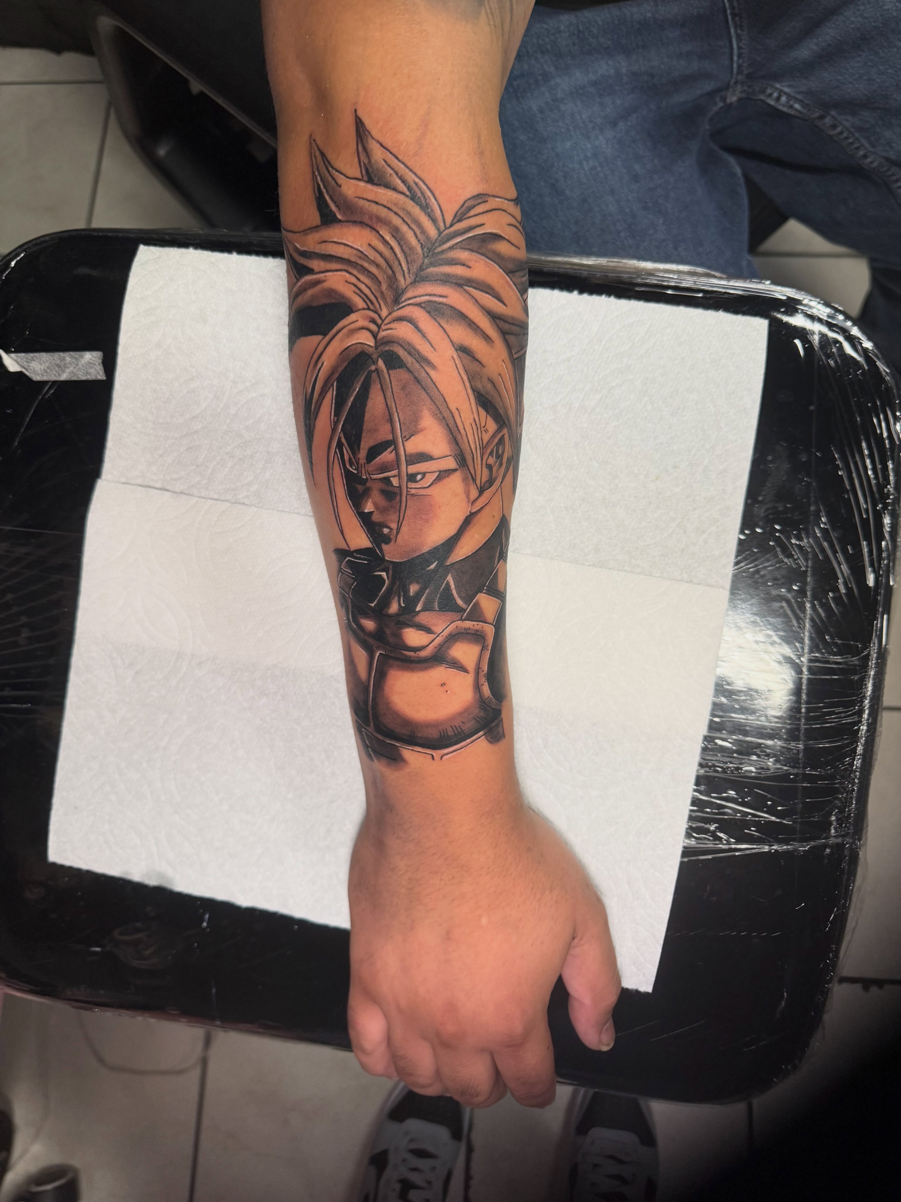 Anime character anime tattoo on the forearm by Jasmin Lozano