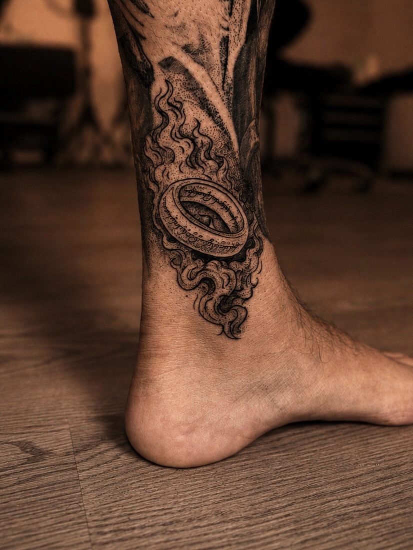 Flame and ring black and grey tattoo on the calf by Bwk Dark Art