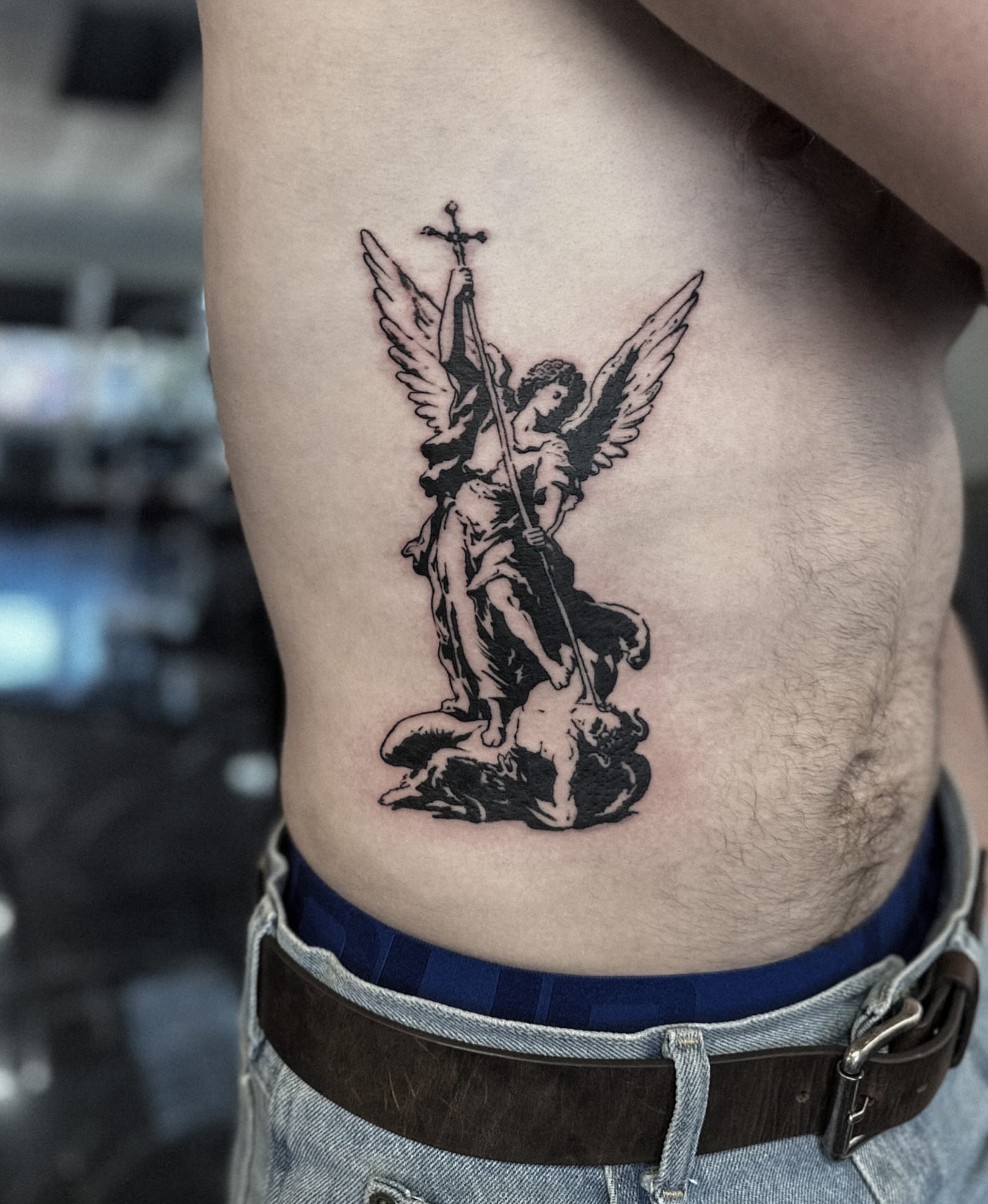 Angel black and grey tattoo on the ribs by Elvira Savchuk