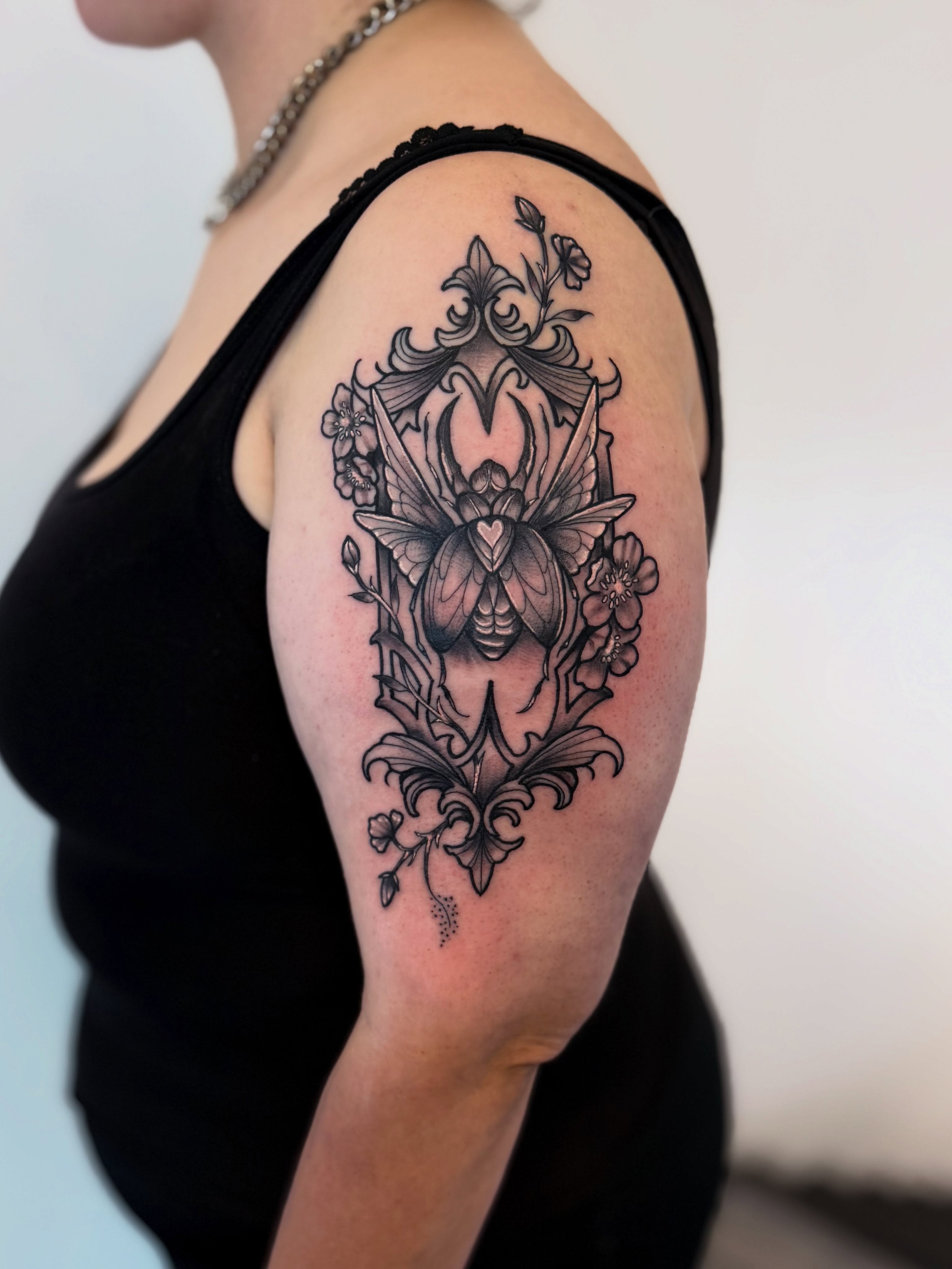 Butterfly and floral ornamental tattoo on the shoulder by Jessica Abbey