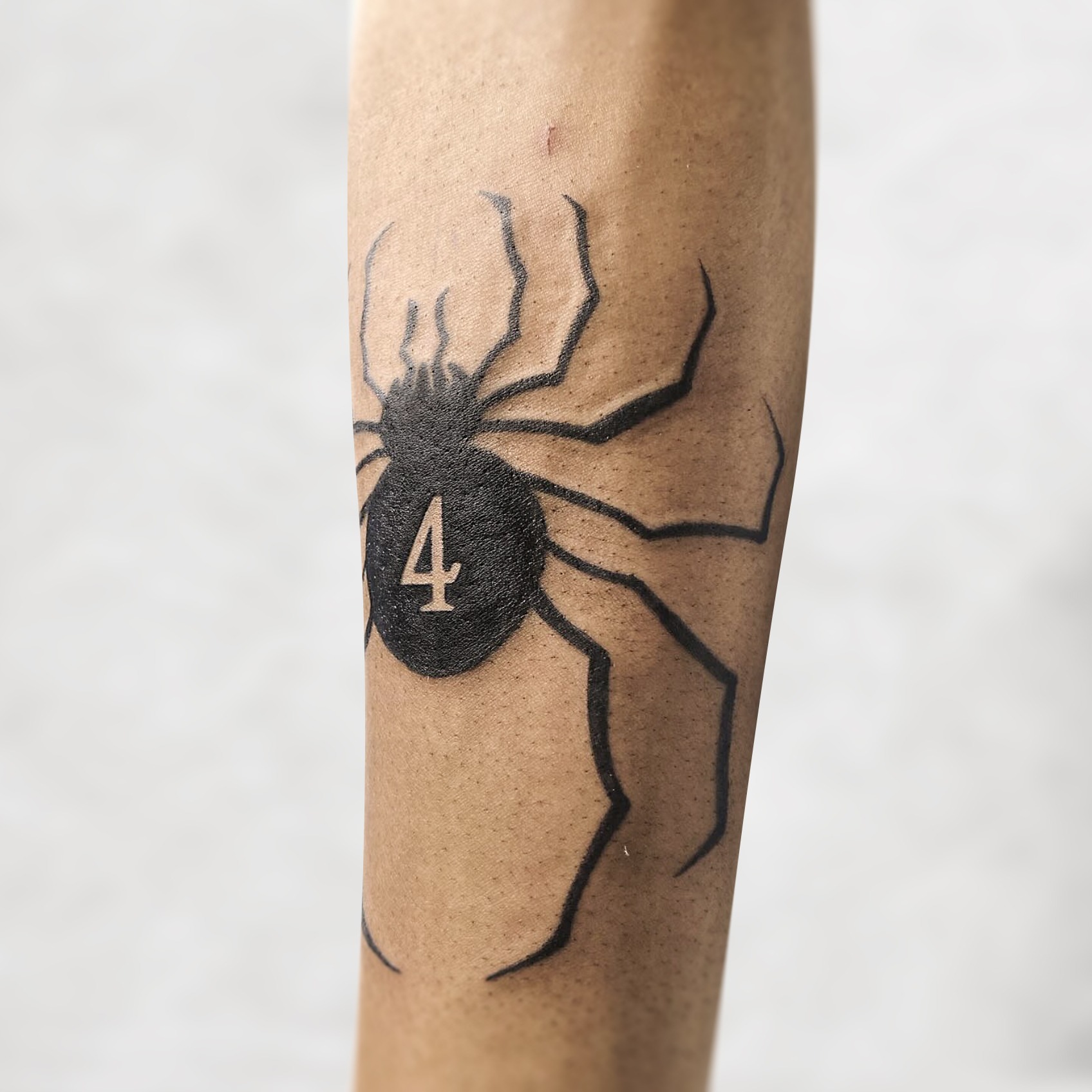 Spider black and grey tattoo on the forearm by R o s e