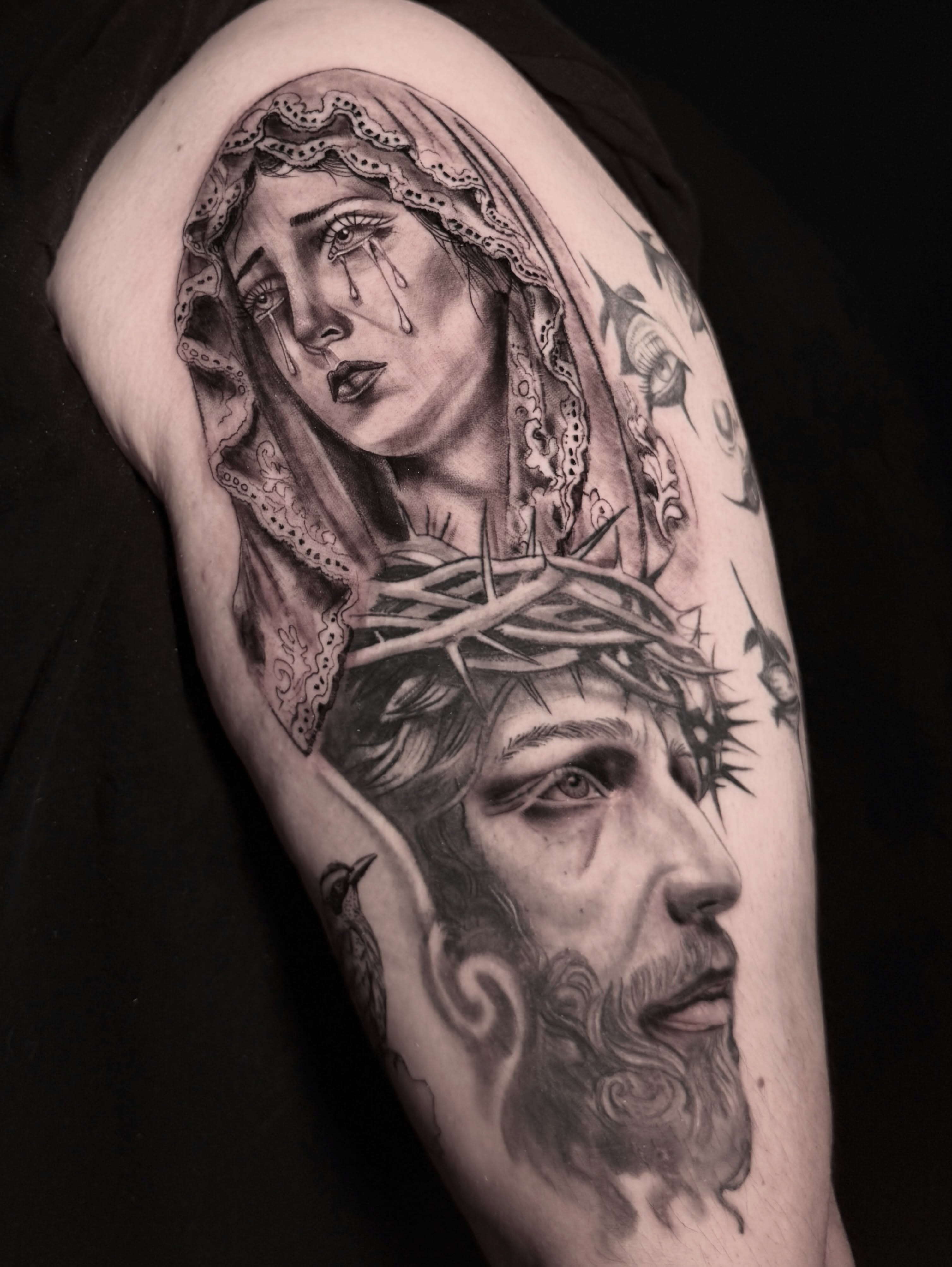 Religious iconography realism tattoo on the shoulder by Alex Cantor