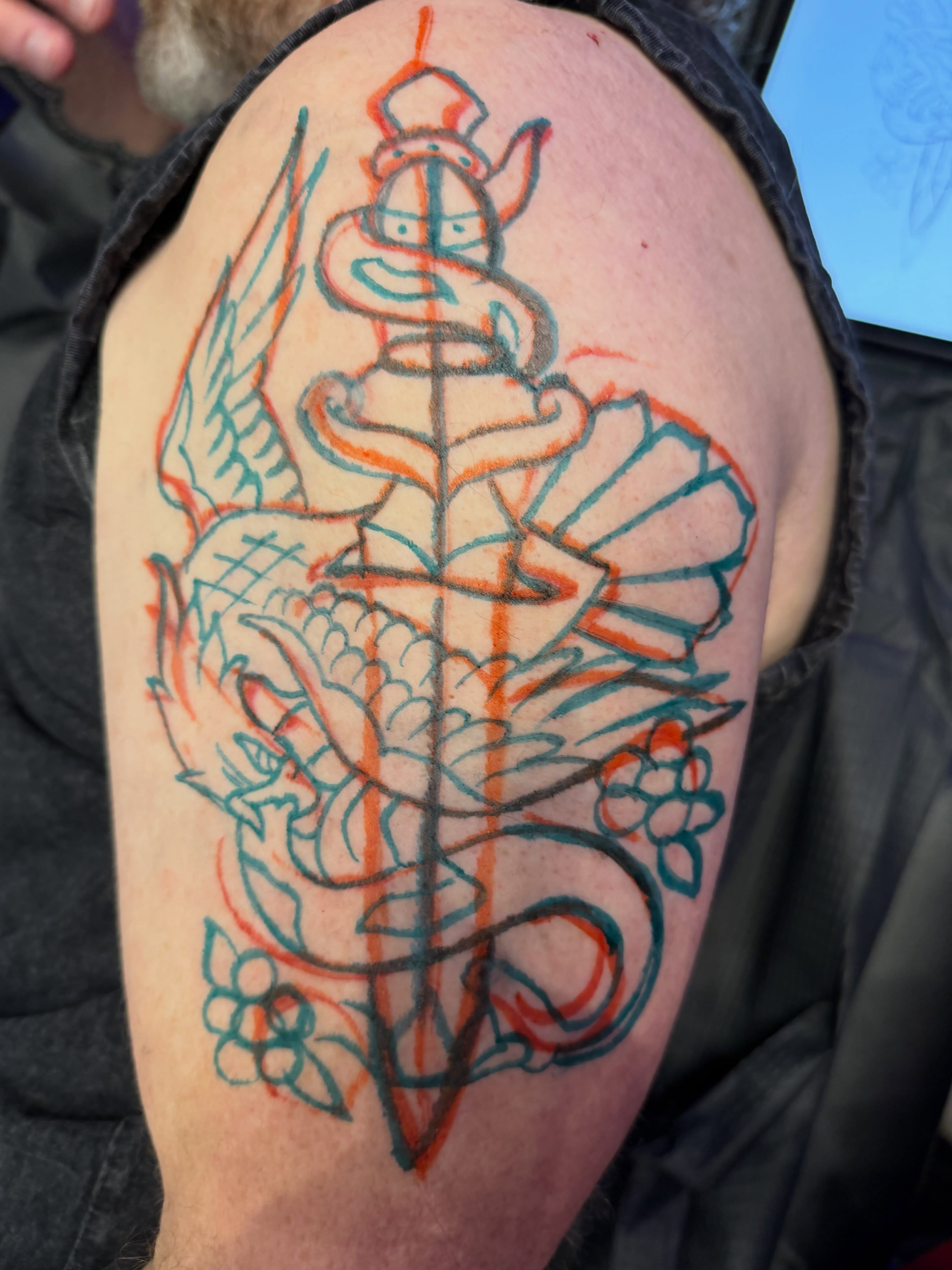 Pirate captain and dragon American traditional tattoo on the shoulder by David Evans