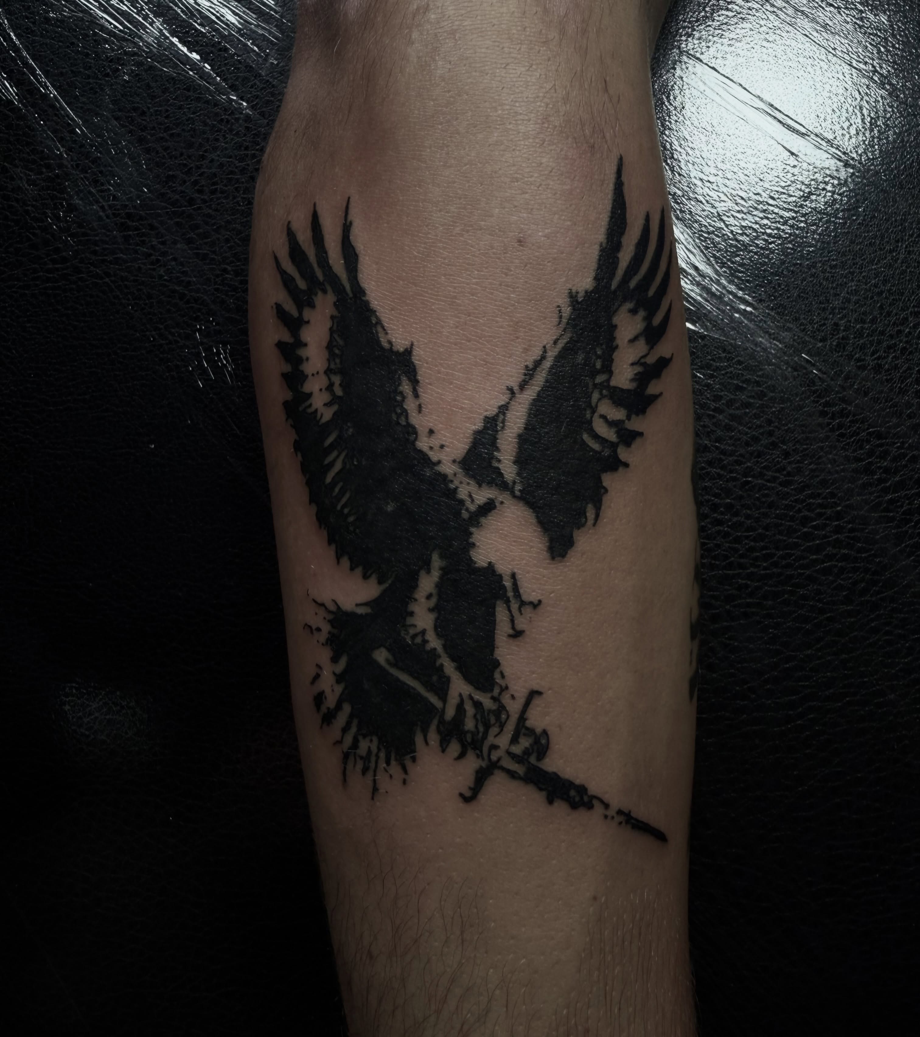 Eagle black and grey tattoo on the forearm by Jordan Sandoval