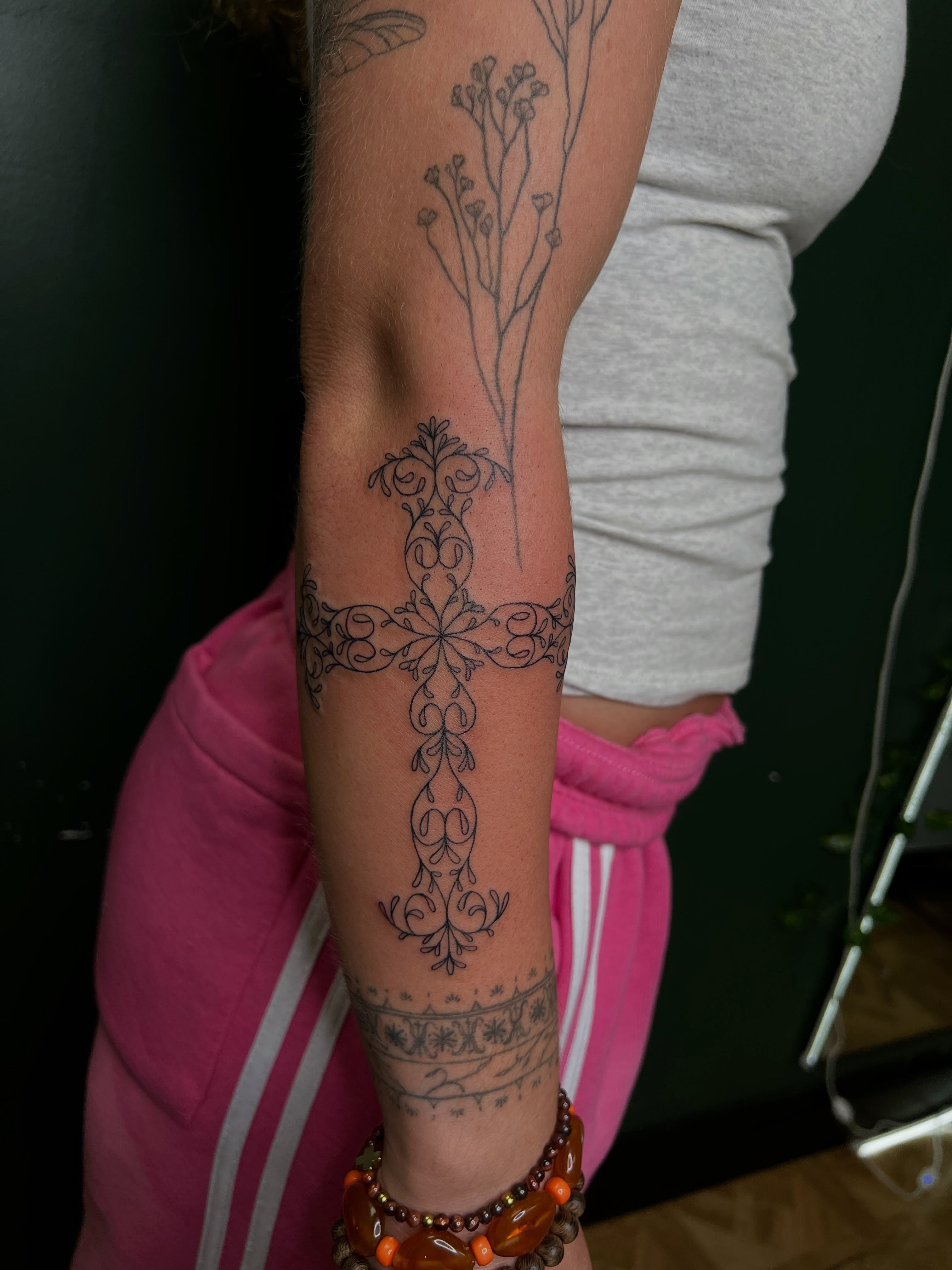 Cross ornamental tattoo on the forearm by Rachel Riendeau π