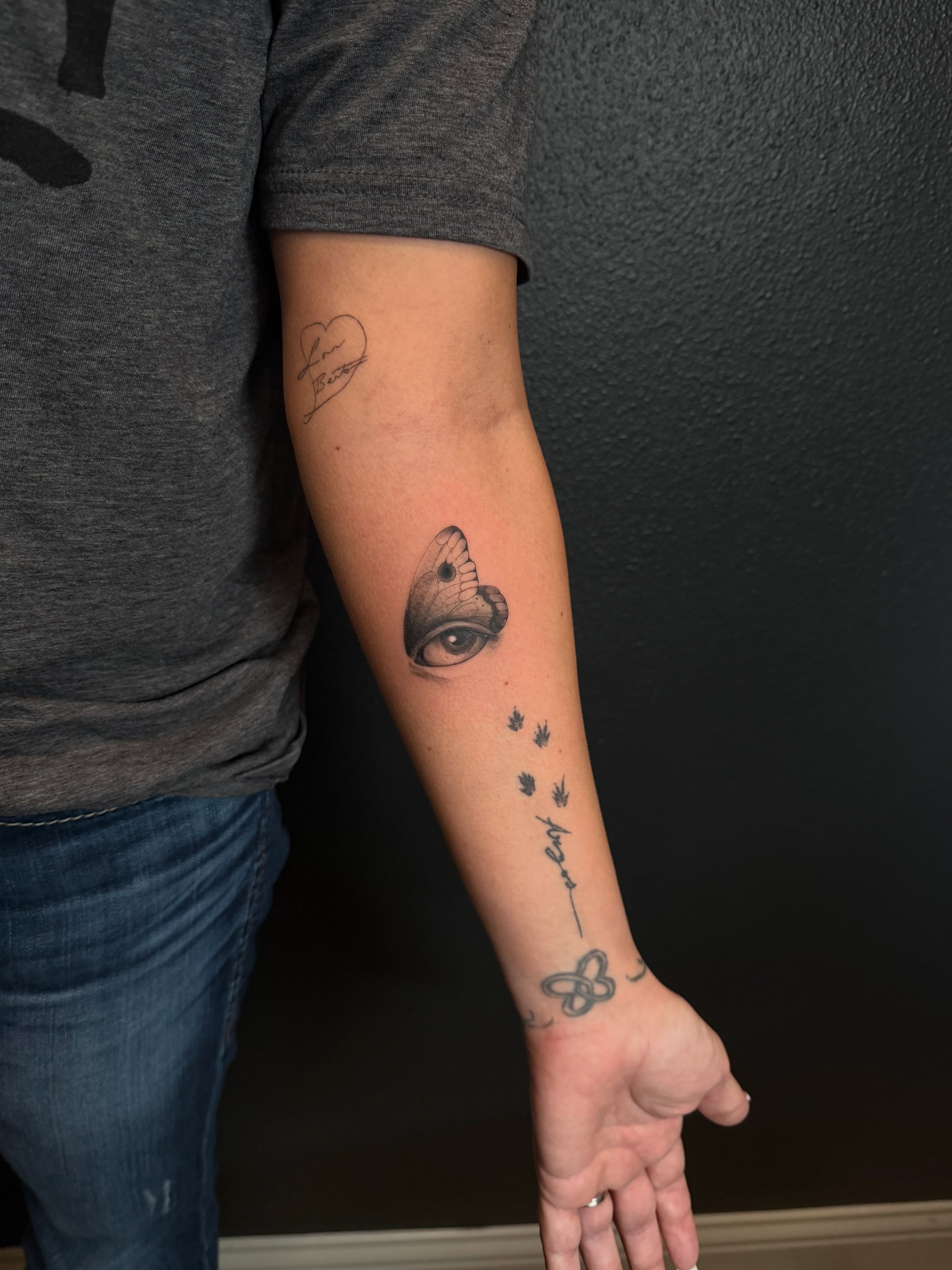 Eye and butterfly realism tattoo on the forearm by Jacksyn, Plano, Texas