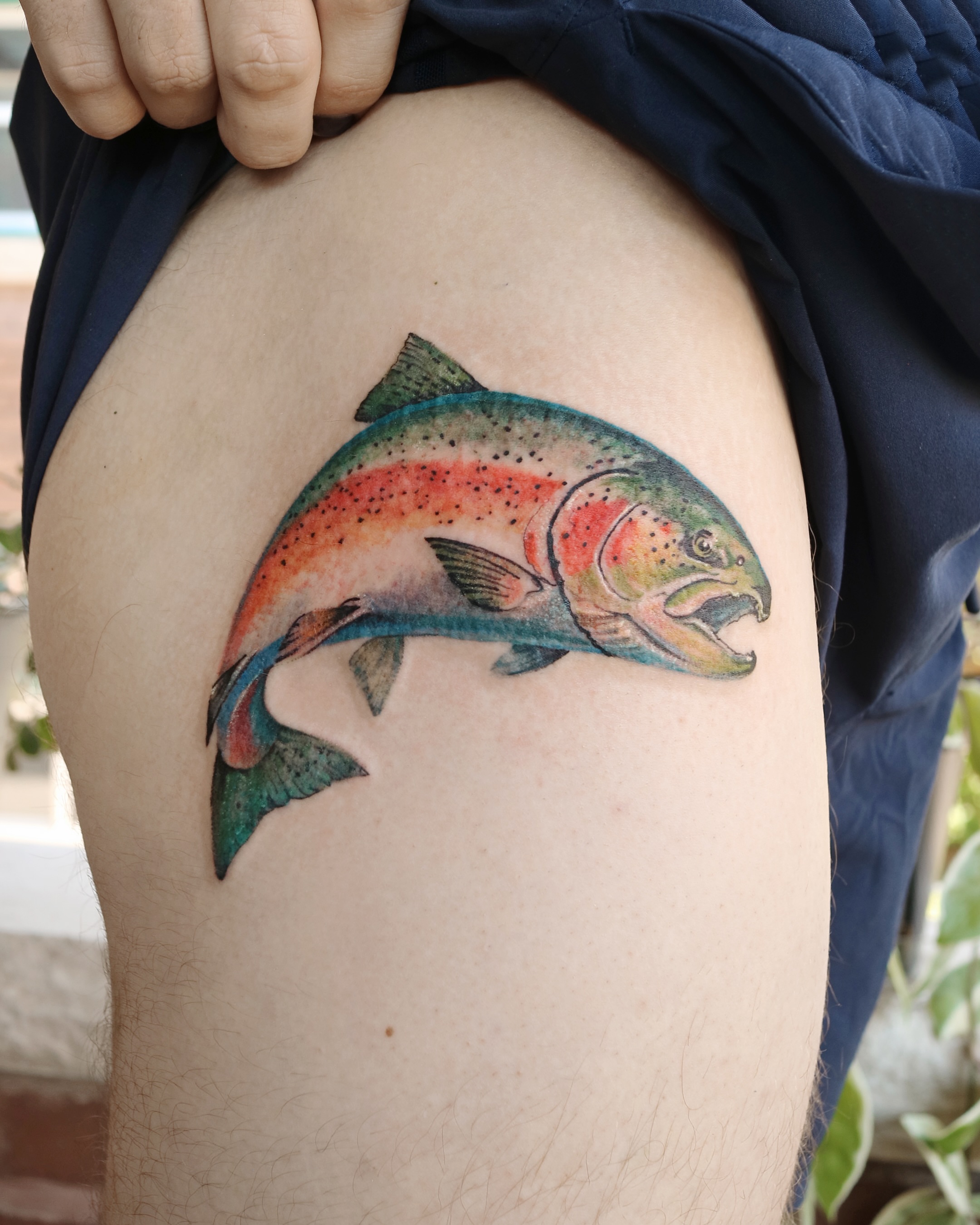 Rainbow trout realism tattoo on the thigh by Aroha