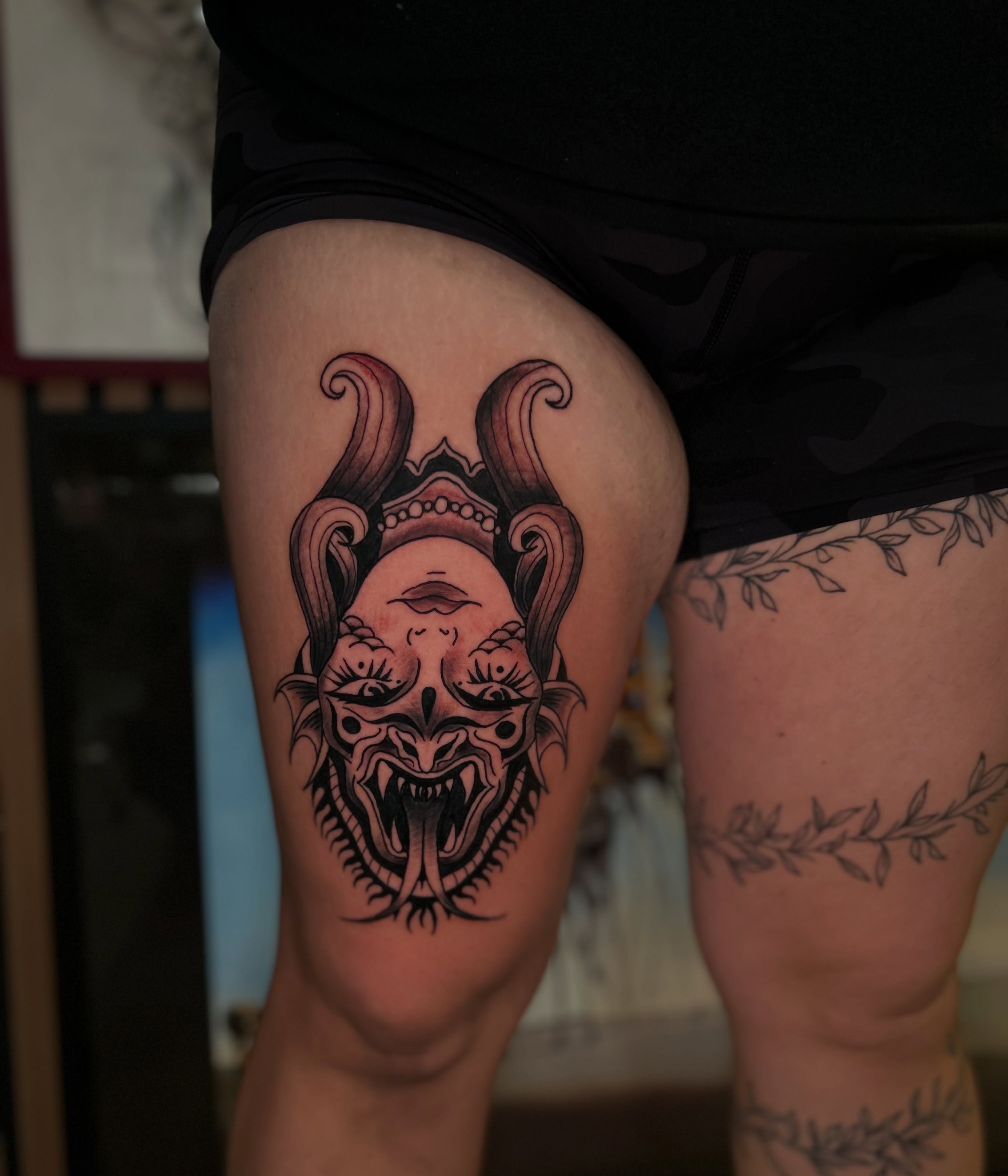 Demon mask japanese irezumi tattoo on the thigh by Torrey, Austin, Texas
