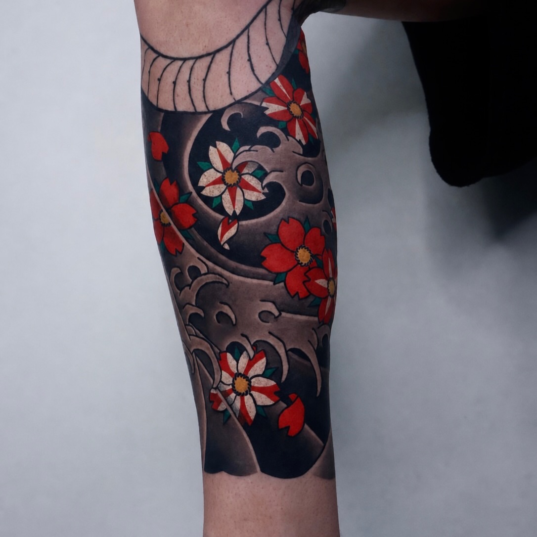 Cherry blossoms and wave japanese irezumi tattoo on the forearm by JM kim, Melbourne, Victoria