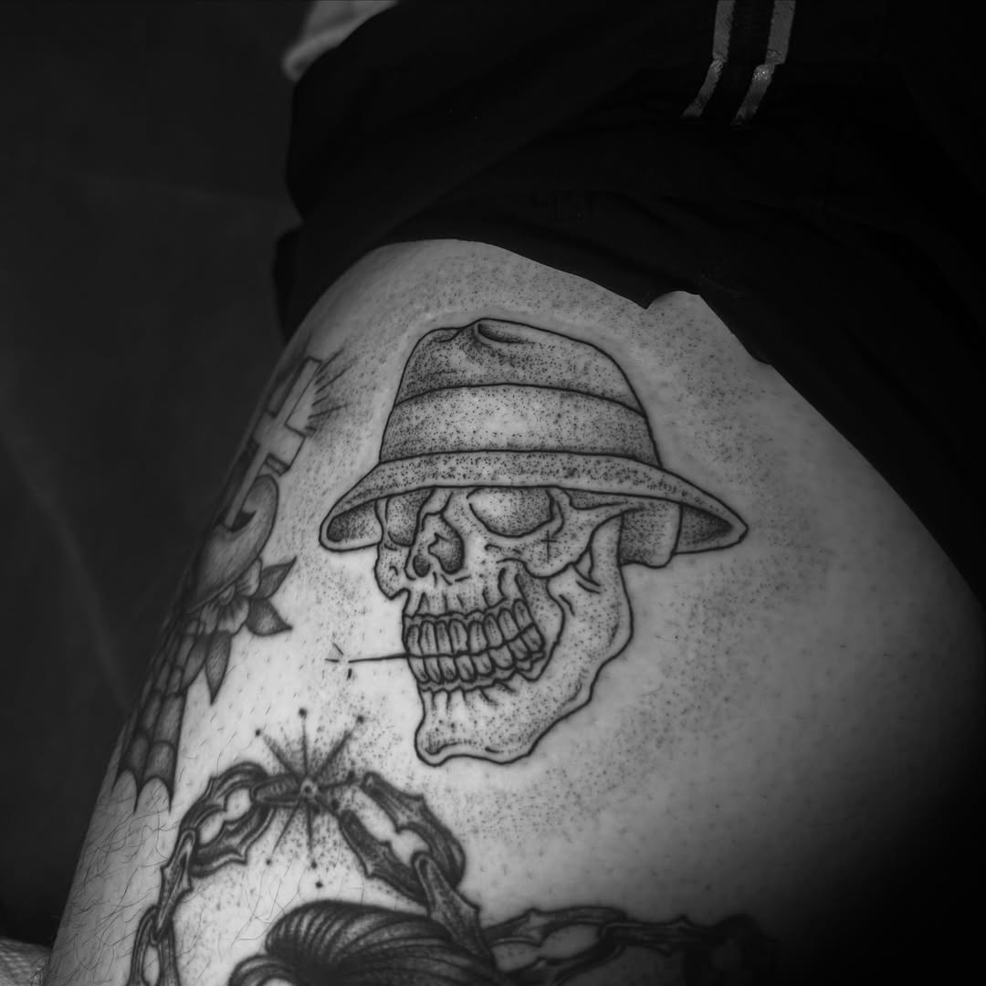 Skull wearing hat dotwork tattoo on the thigh by Giana Martinez, Wichita, Kansas