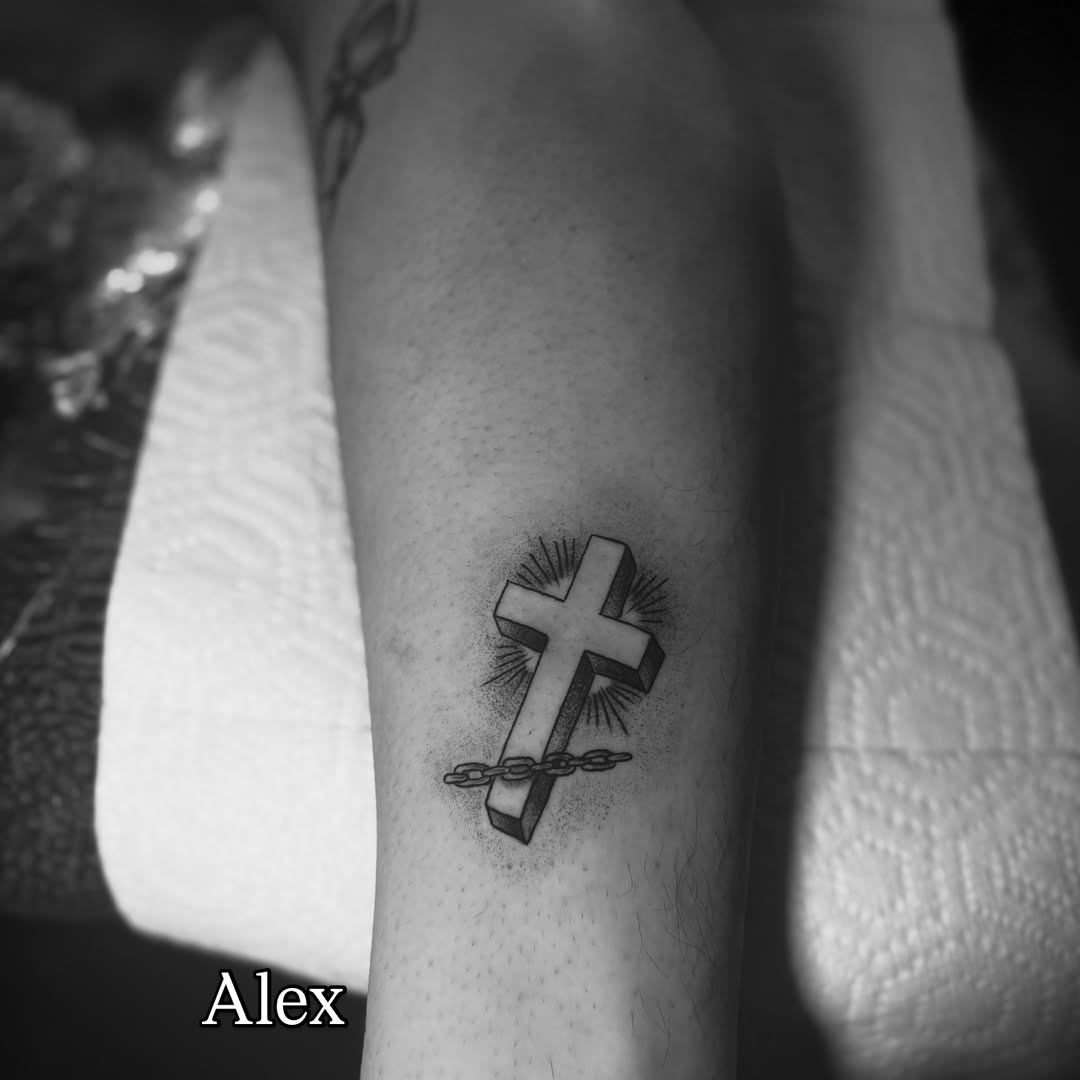 Cross dotwork tattoo on the forearm by Giana Martinez, Wichita, Kansas