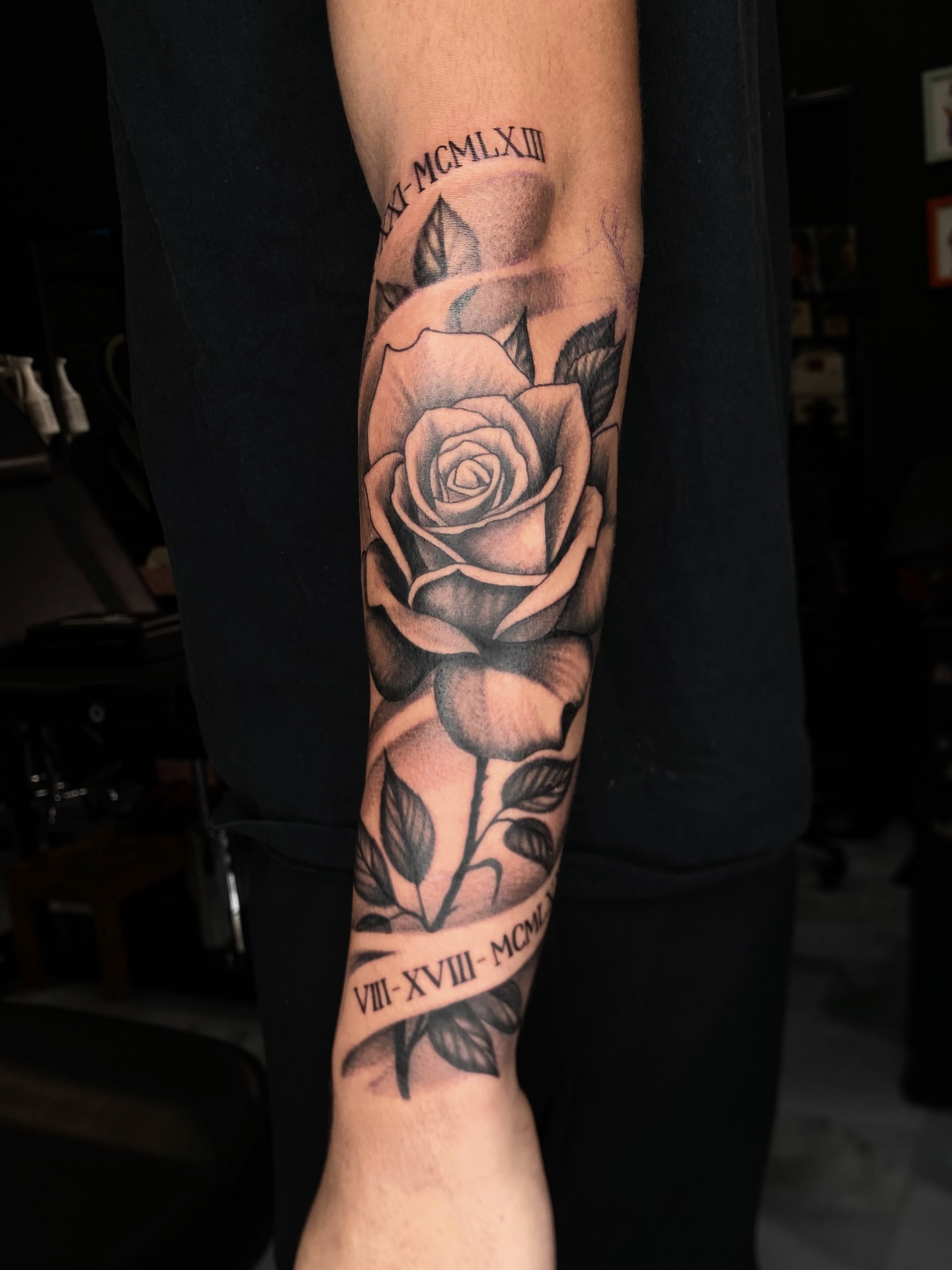 Rose black and grey tattoo on the forearm by Exis LHinc, Miami, Florida