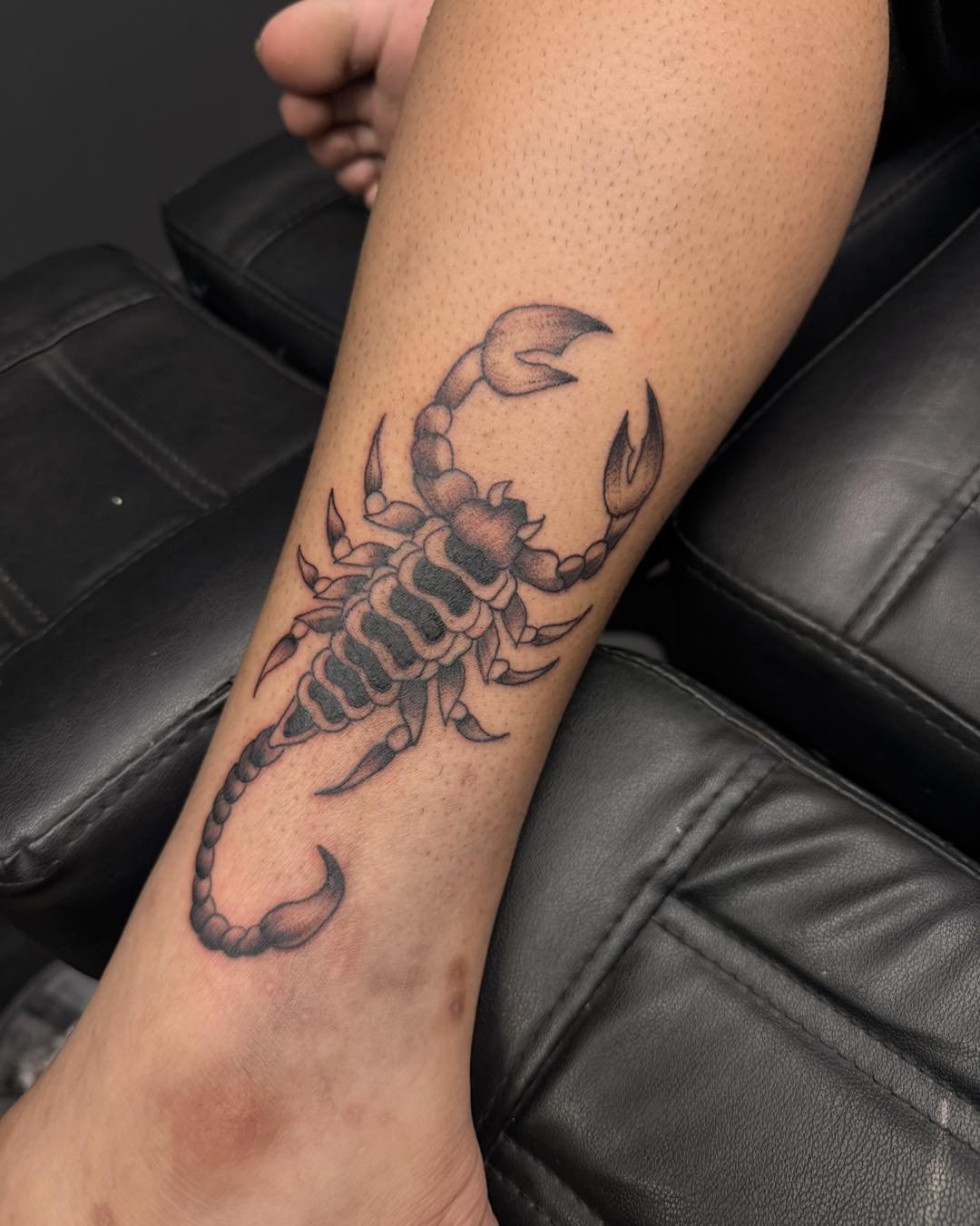 Scorpion black and grey tattoo on the forearm by Flamboyant