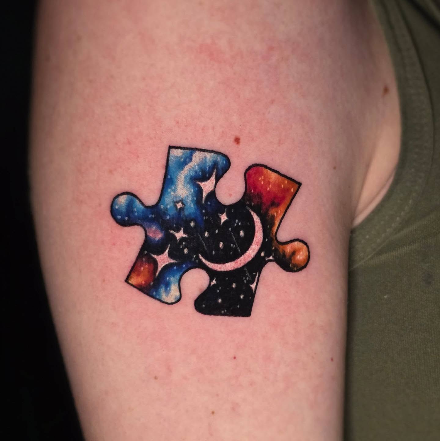 Galaxy puzzle pieces dotwork tattoo on the forearm by Banana Cake