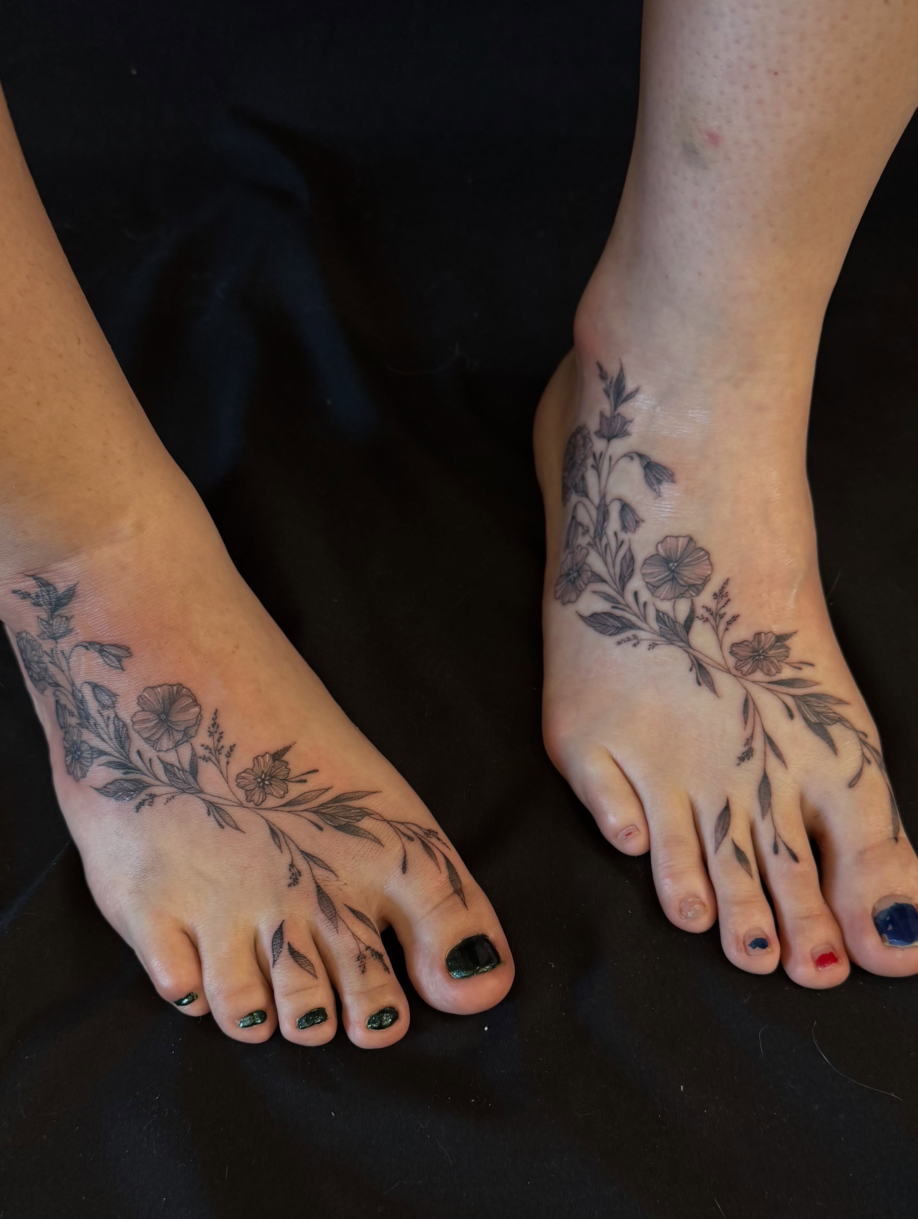 Floral vine black and grey tattoo on the foot by Dre