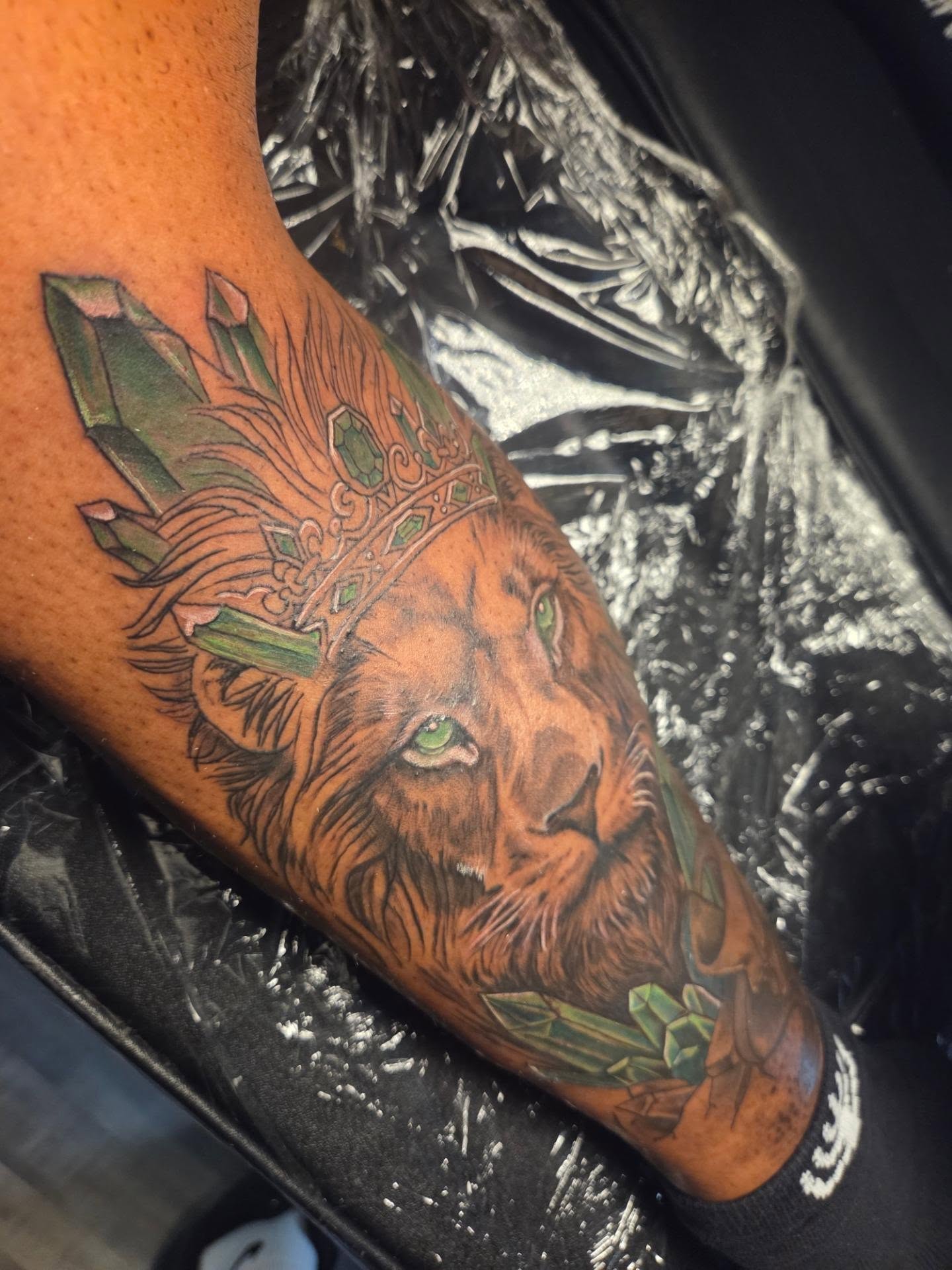 Lion with crown realism tattoo on the forearm by Klazzik Mayfield, Fort Lauderdale, Florida