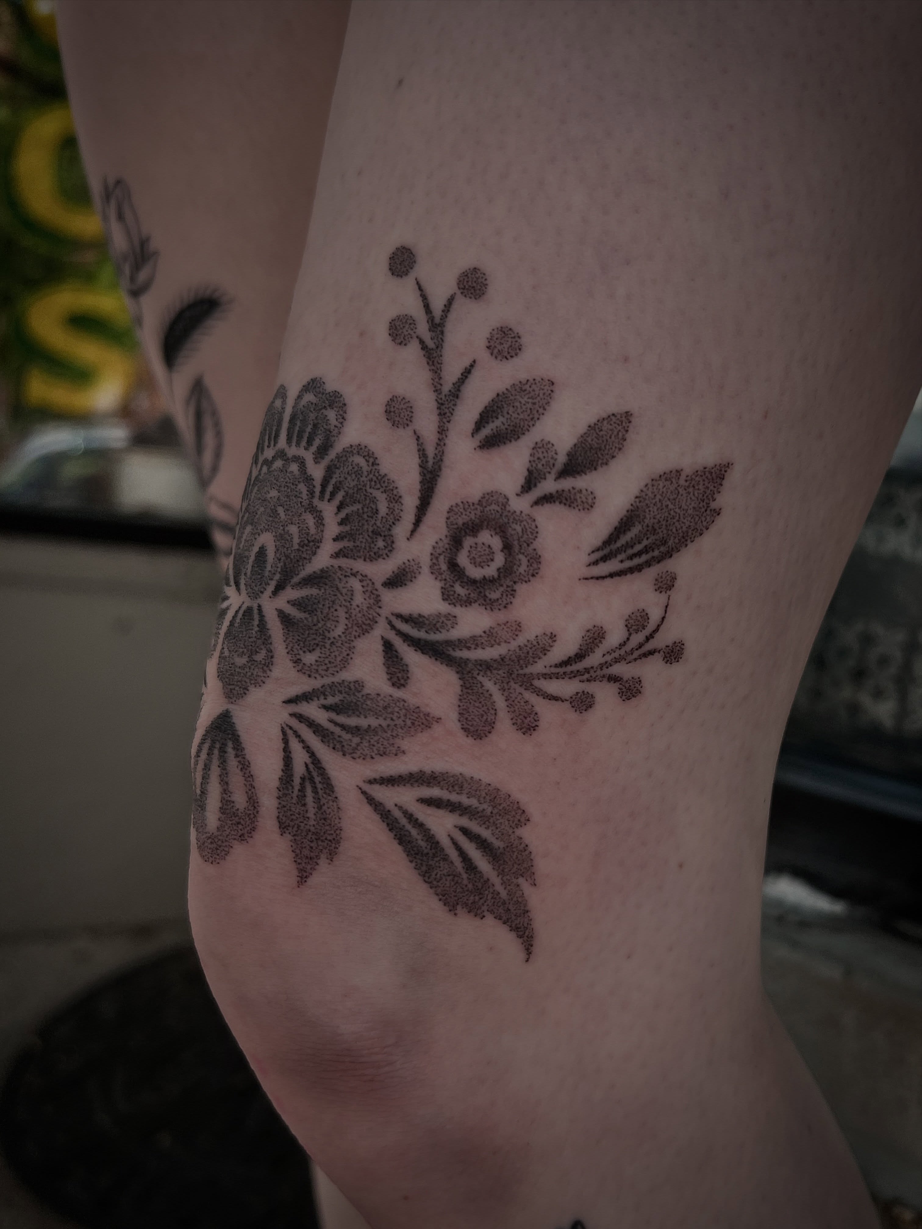 Floral bouquet dotwork tattoo on the forearm by Jen Rahman