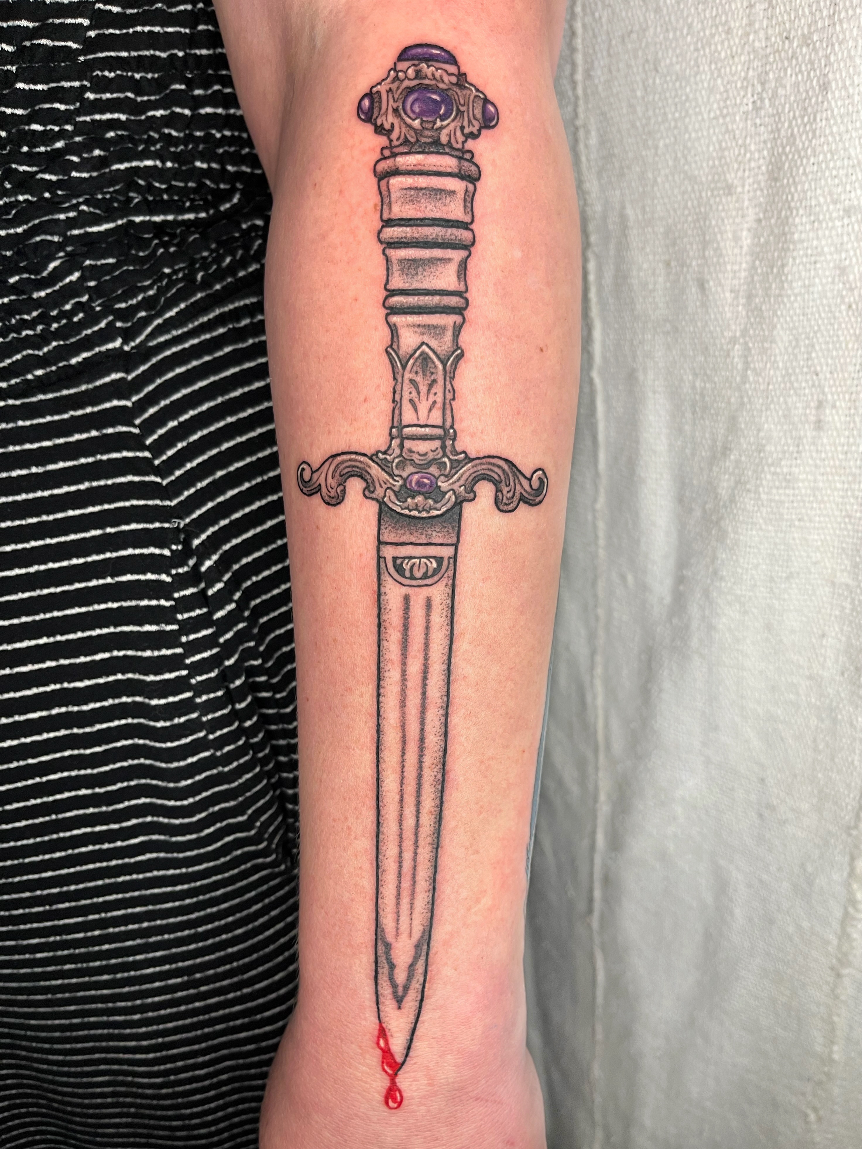 Sword black and grey tattoo on the forearm by Maris Hare, Philadelphia, Pennsylvania