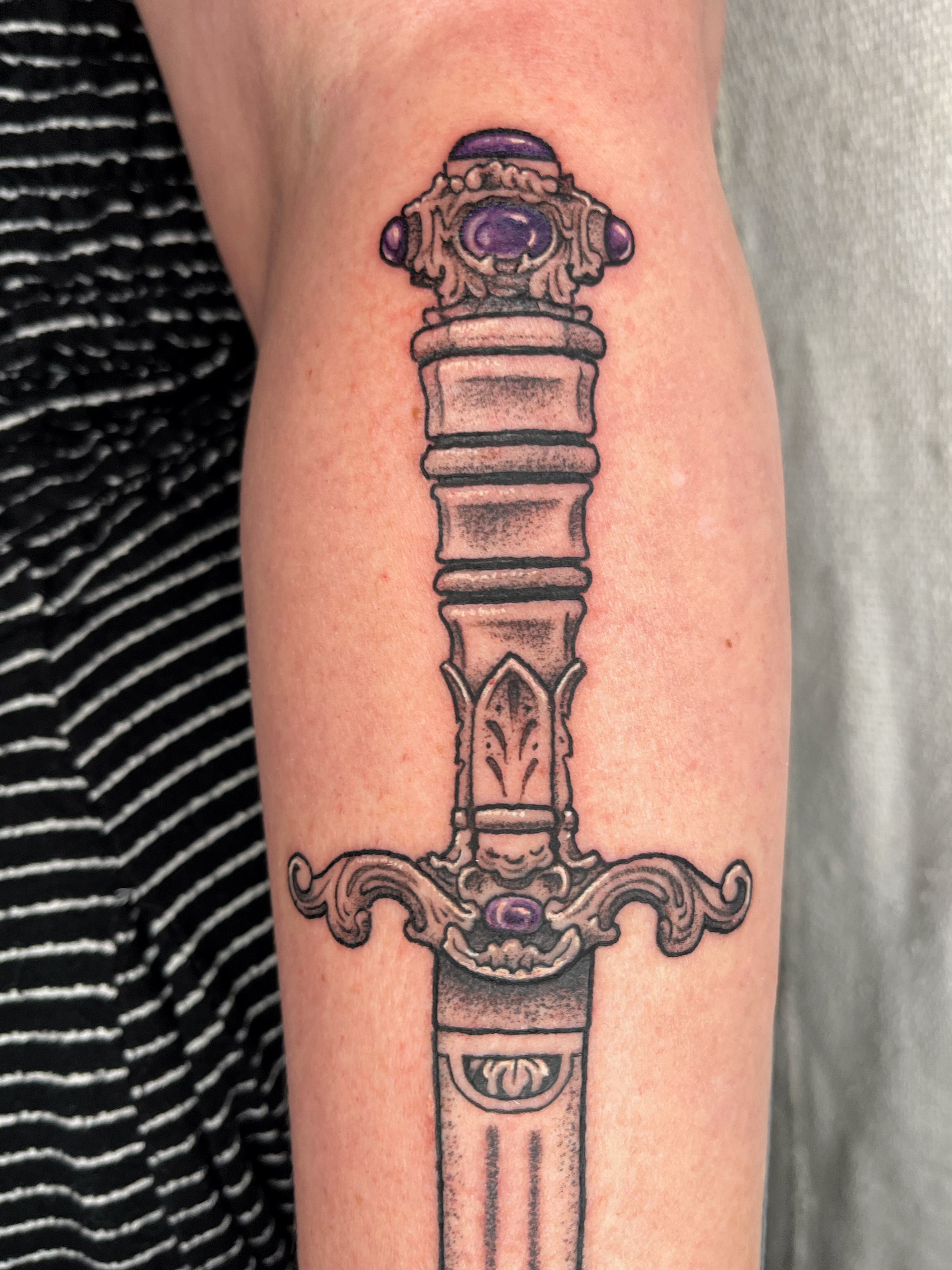 Sword dotwork tattoo on the forearm by Maris Hare, Philadelphia, Pennsylvania