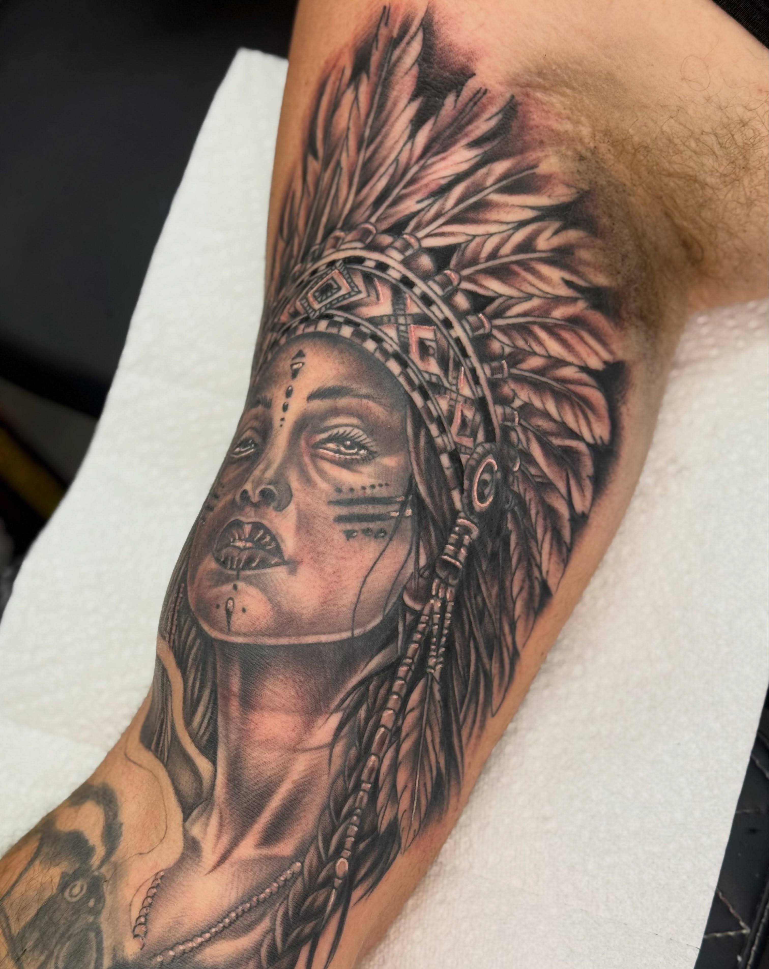 Indian headdress realism tattoo on the forearm by Jake Horstman, Dayton, Ohio