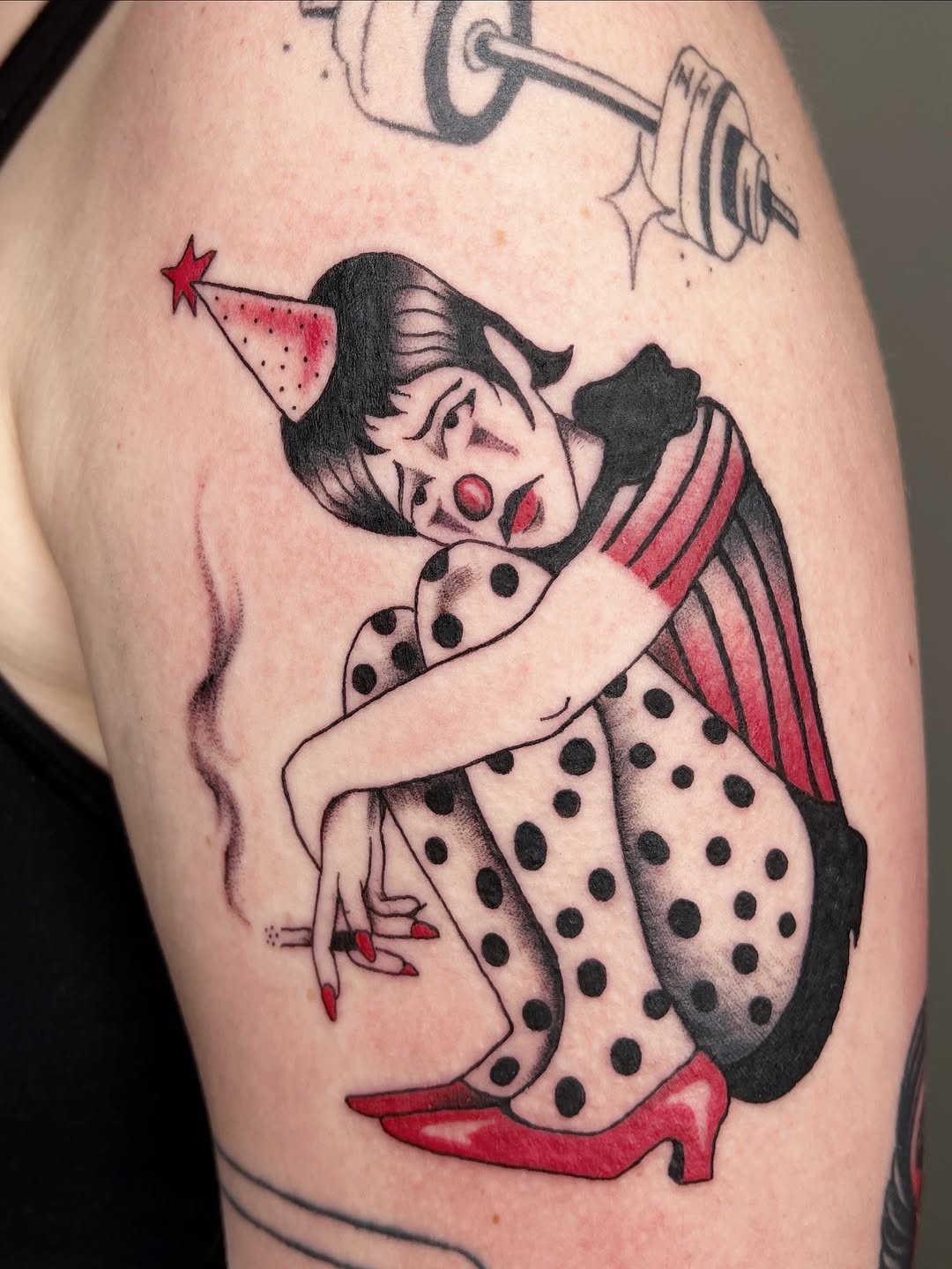 Sad clown smoking neo-traditional tattoo on the upper arm by Elleree (LRE)