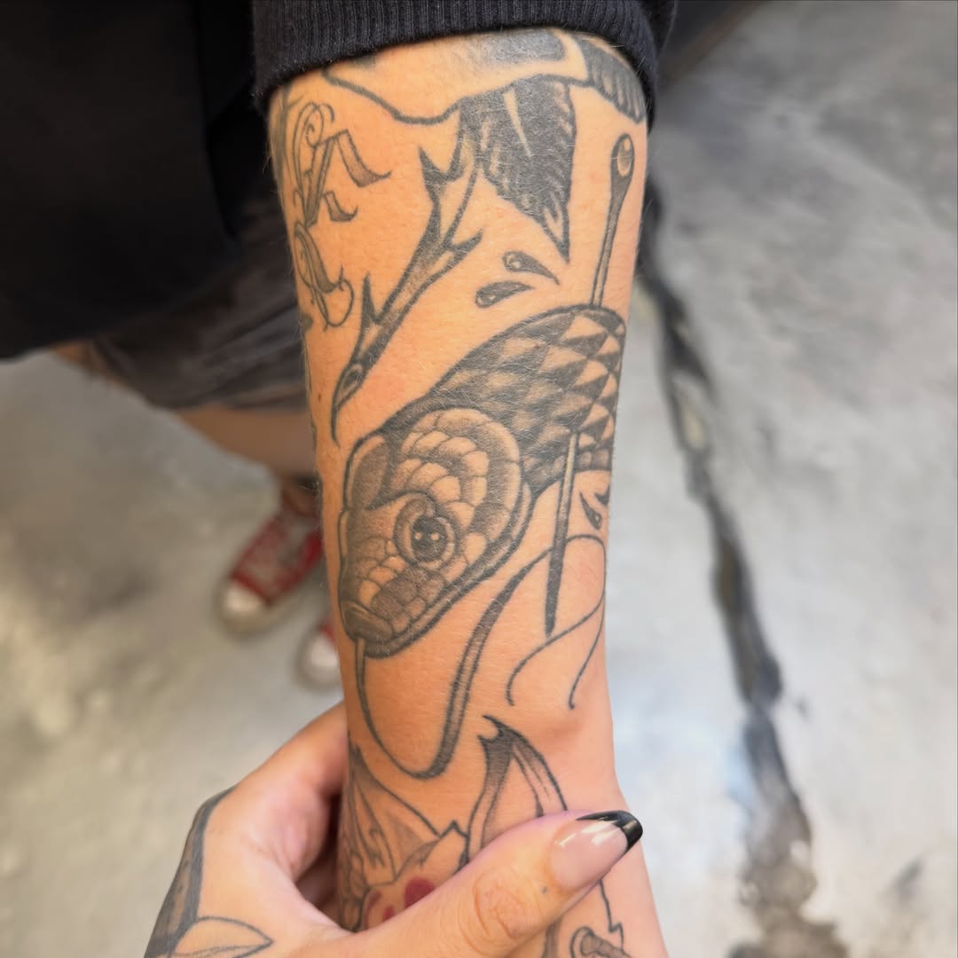 Fish and seashell black and grey tattoo on the forearm by zoey sage ✦