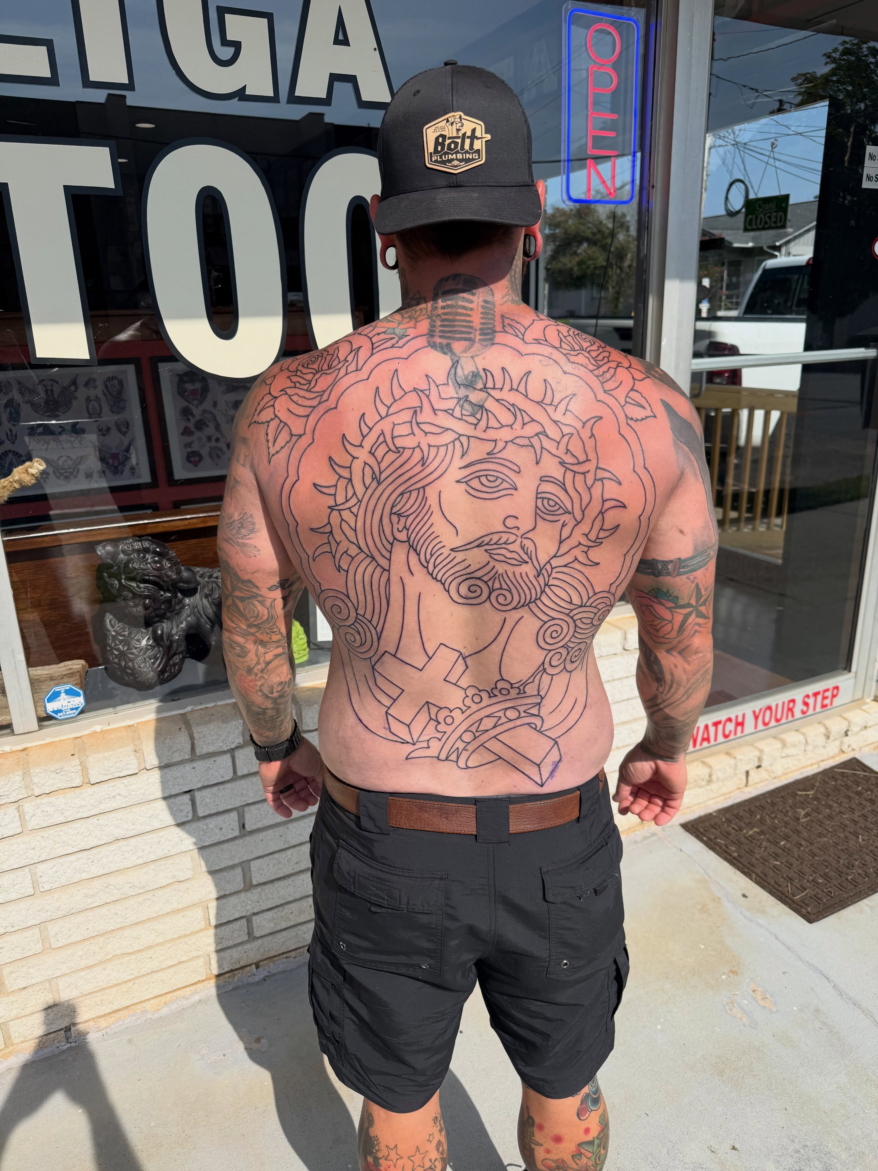 Religious figure black and grey tattoo on the back by Cody Dalton