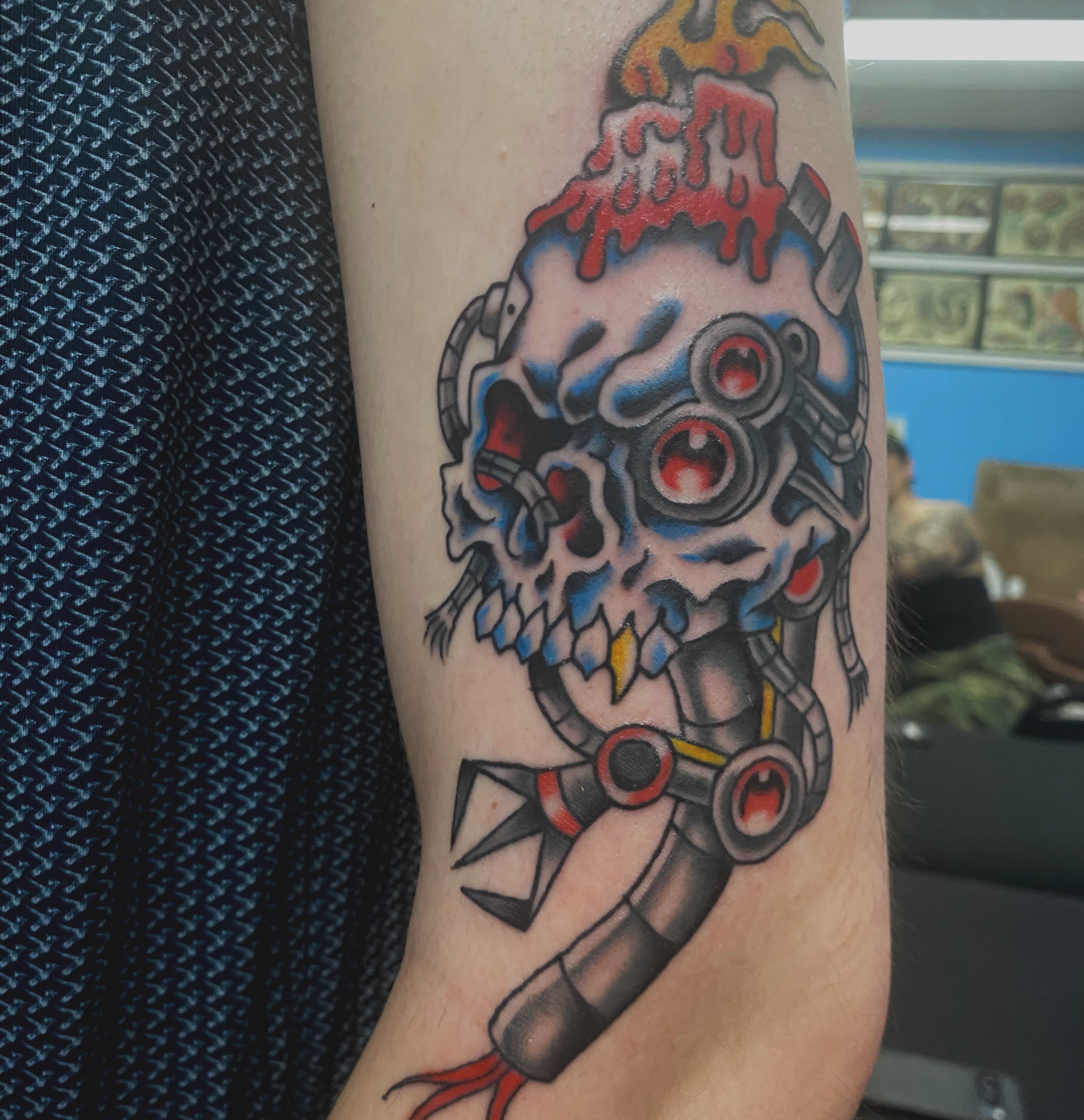 Cyborg skull American traditional tattoo on the forearm by @katie_tatts