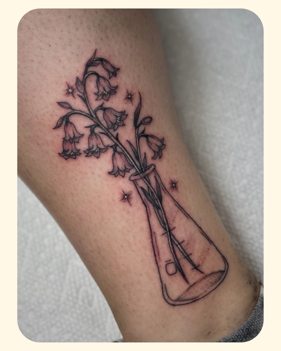 Bellflowers in a vase black and grey tattoo on the forearm by 𝐒𝐚𝐦𝐬𝐨𝐧𝐋𝐚𝐳𝐚𝐫𝐭𝐞