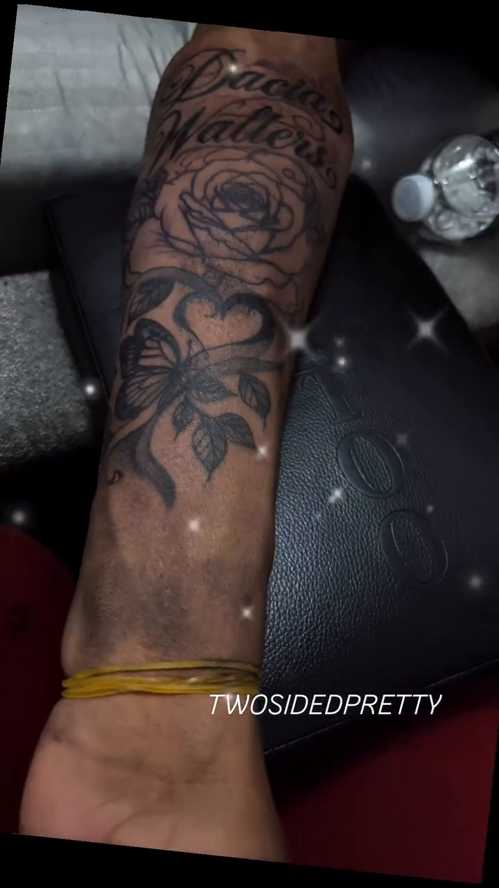 Rose and lettering tattoo on the upper arm by @twosidedpretty