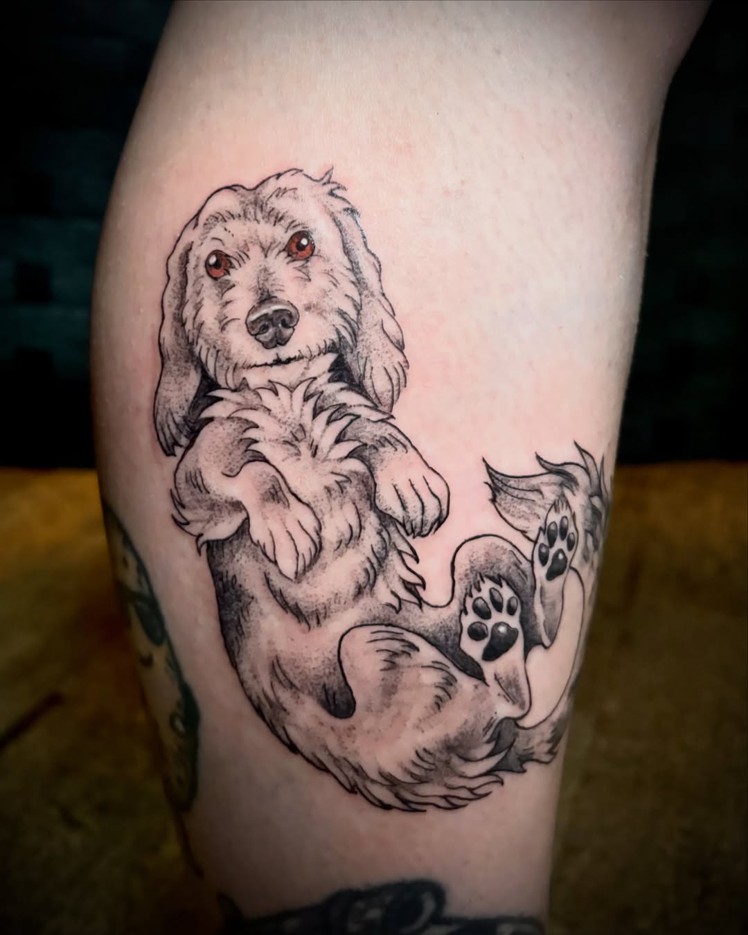 Dog realism tattoo on the thigh by Abby Ruok, Midvale, Utah